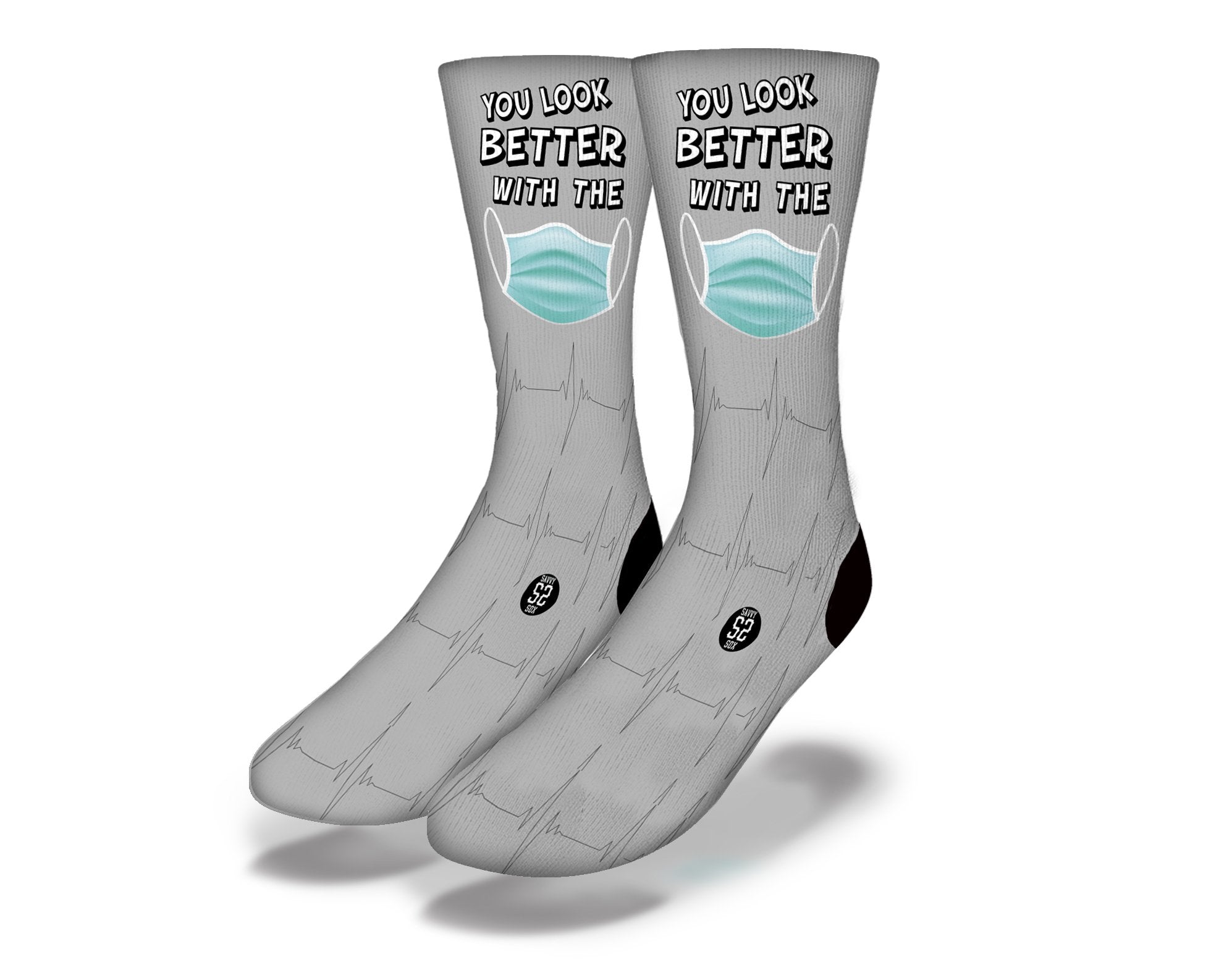 A pair of grey novelty socks with a humorous message about wearing a mask, perfect for adding fun to your wardrobe.