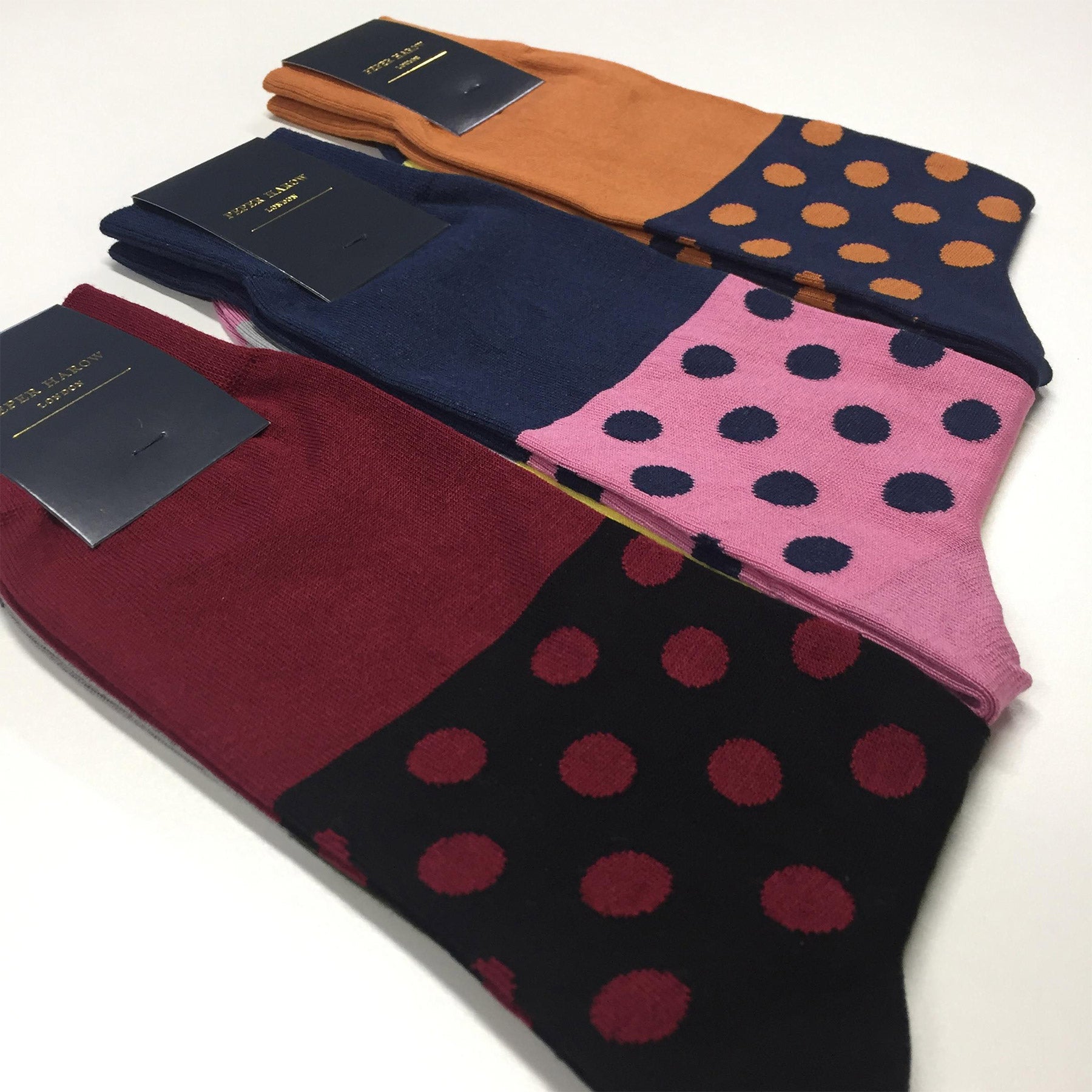 Mayfair Men's Socks in burgundy with black and burgundy polka dots and green-grey sole, showcasing luxury and style.