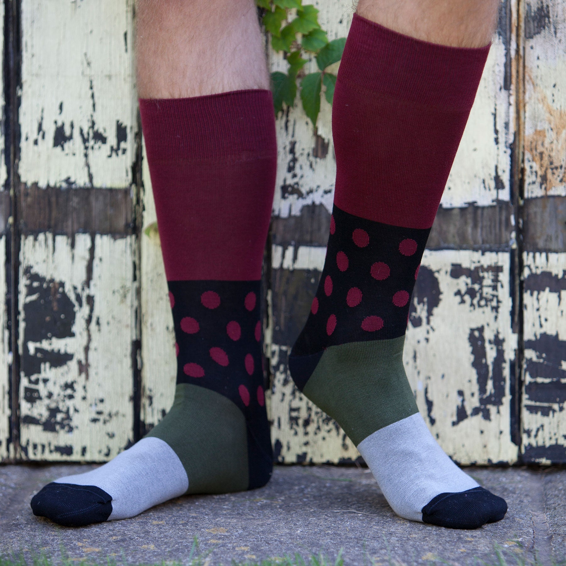 Mayfair Men's Socks in burgundy with black and burgundy polka dots and green-grey sole, showcasing luxury and style.