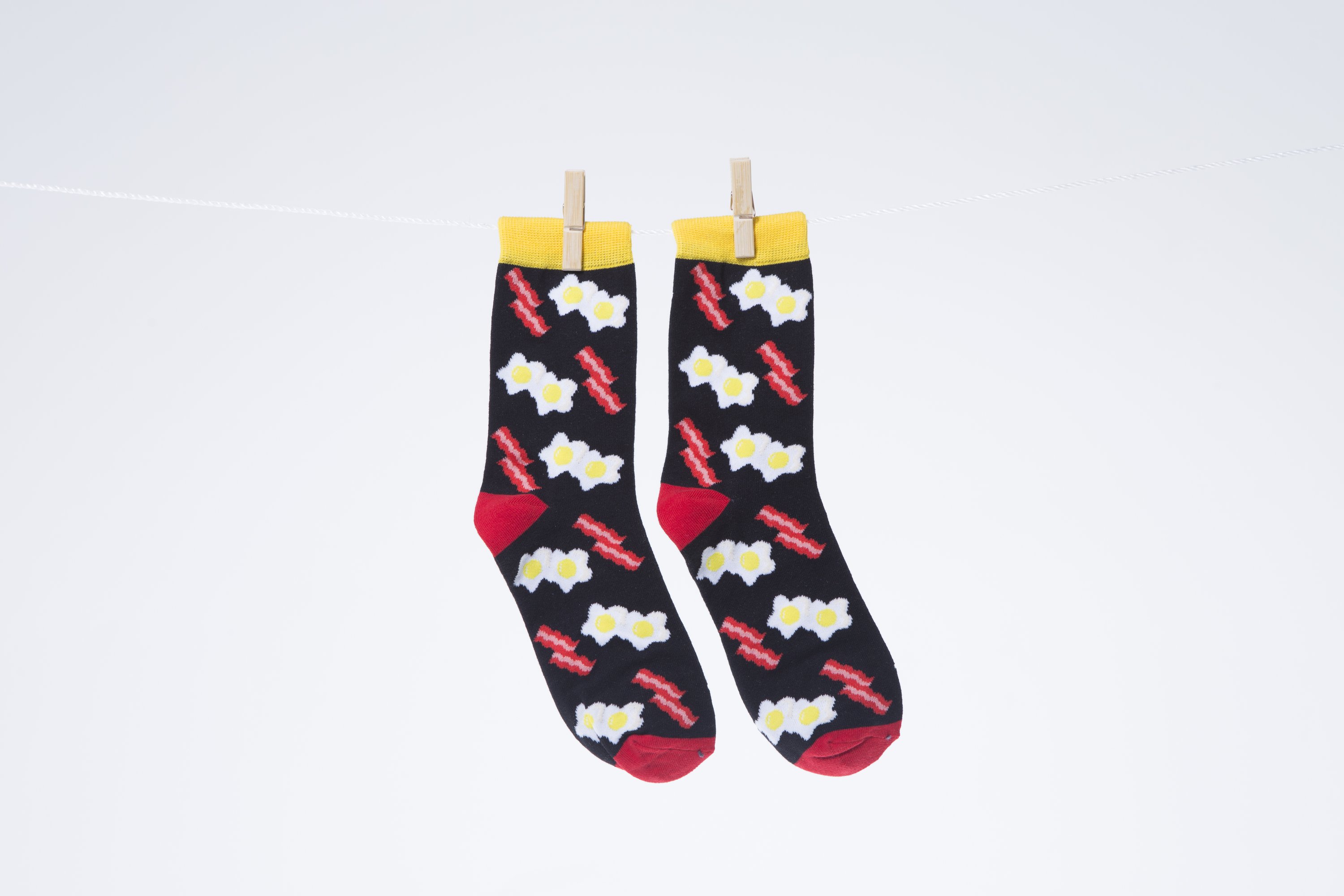 Men's Bacon Socks featuring a fun bacon design, made from soft combed cotton.