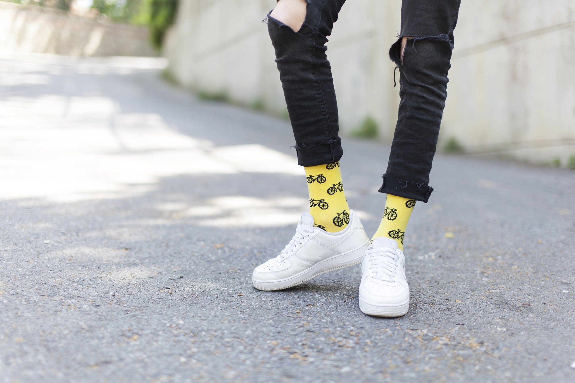 A pair of colorful men's bicycle socks featuring trendy patterns and made from soft Turkish cotton, ideal for comfort and style.