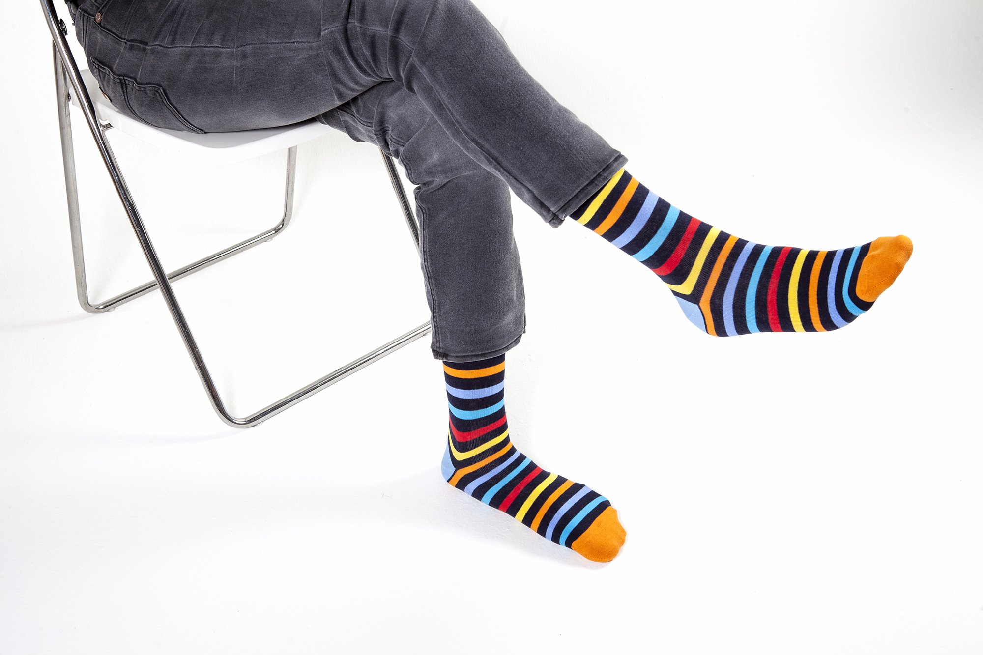 Men's Black Rainbow Stripe Socks featuring vibrant colors and a stylish design, perfect for adding flair to any outfit.