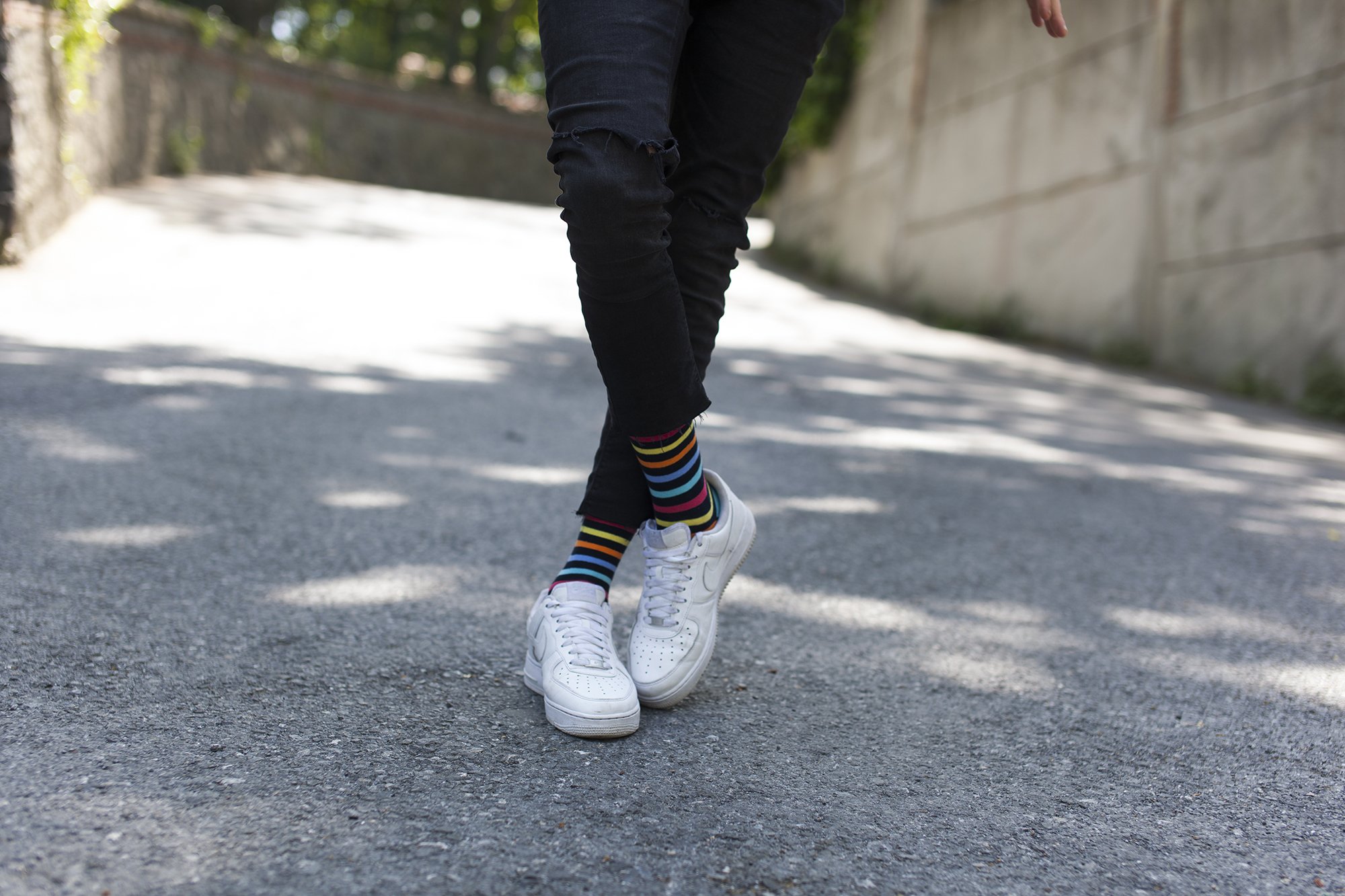 Men's Black Rainbow Stripe Socks featuring vibrant colors and a stylish design, perfect for adding flair to any outfit.