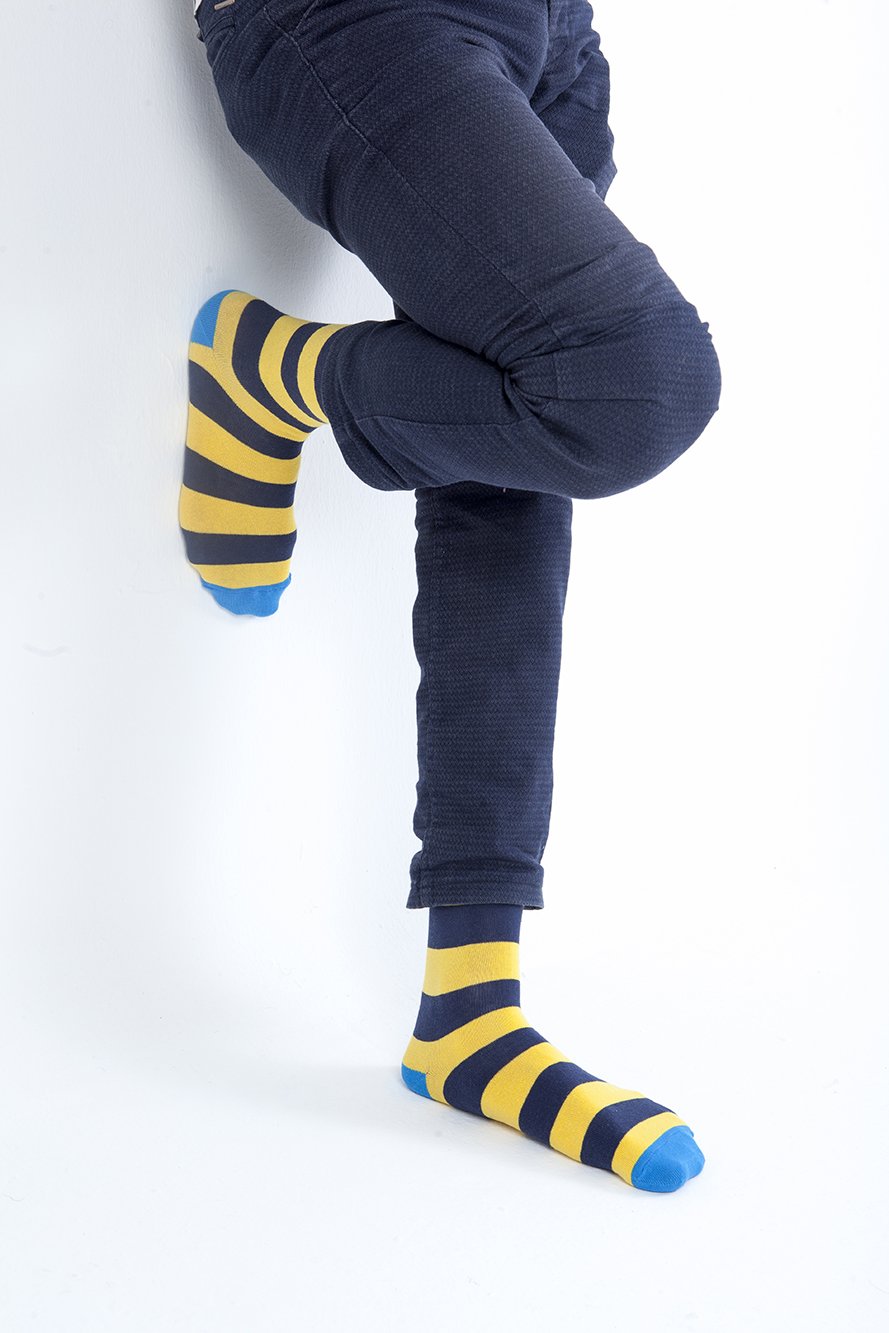 Men's Blue Canary Stripe Socks featuring vibrant colors and trendy patterns, made from soft Turkish cotton for comfort.