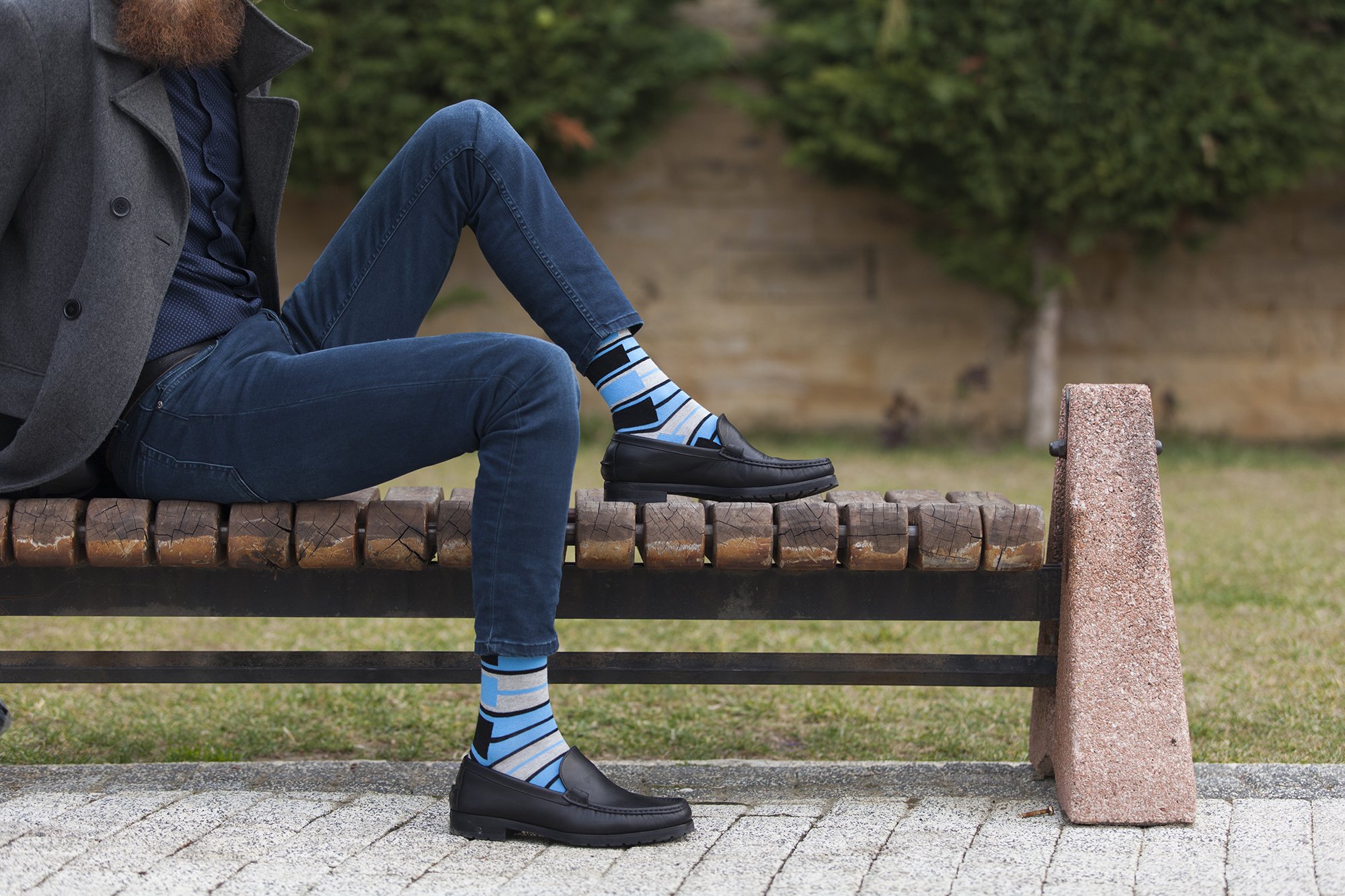 Men's blue patterned socks featuring vibrant designs and soft cotton material, perfect for stylish comfort.