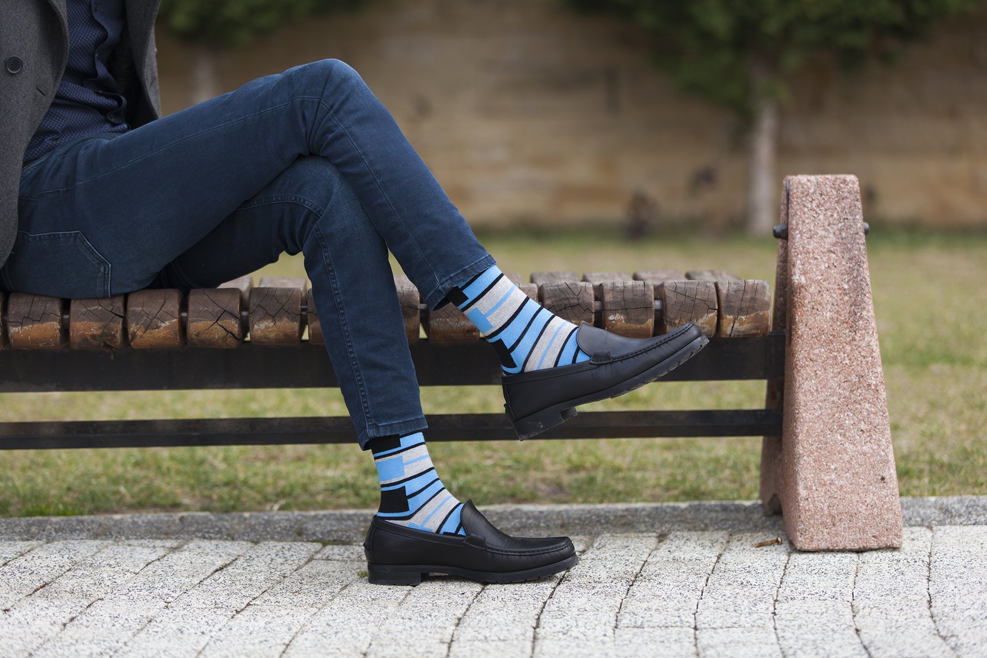 Men's blue patterned socks featuring vibrant designs and soft cotton material, perfect for stylish comfort.