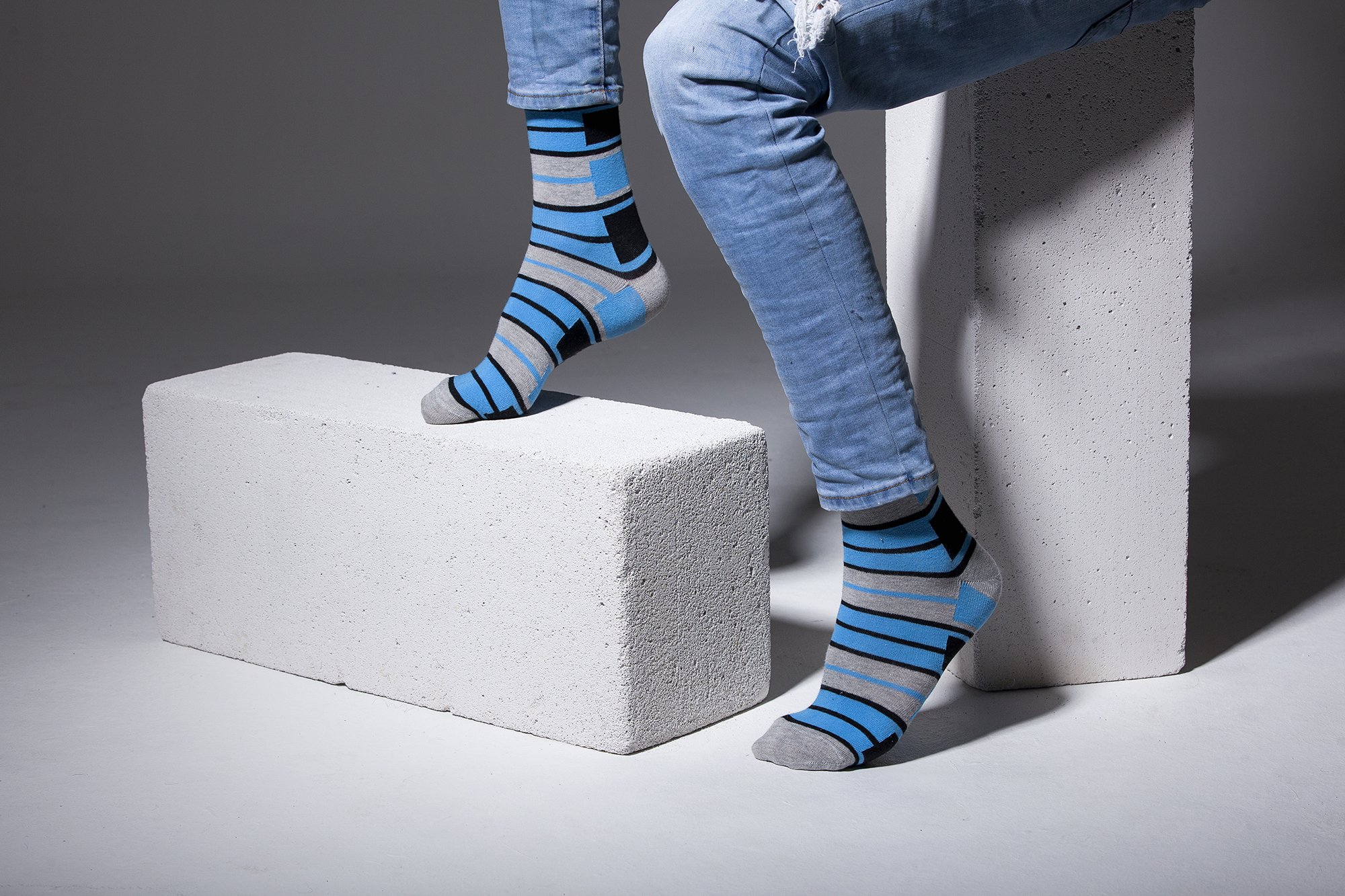 Men's blue patterned socks featuring vibrant designs and soft cotton material, perfect for stylish comfort.