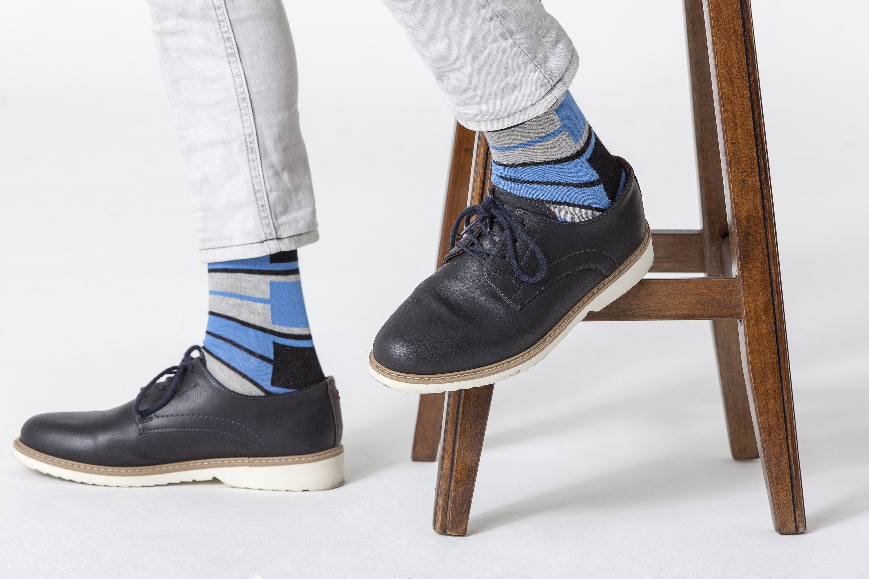 Men's blue patterned socks featuring vibrant designs and soft cotton material, perfect for stylish comfort.