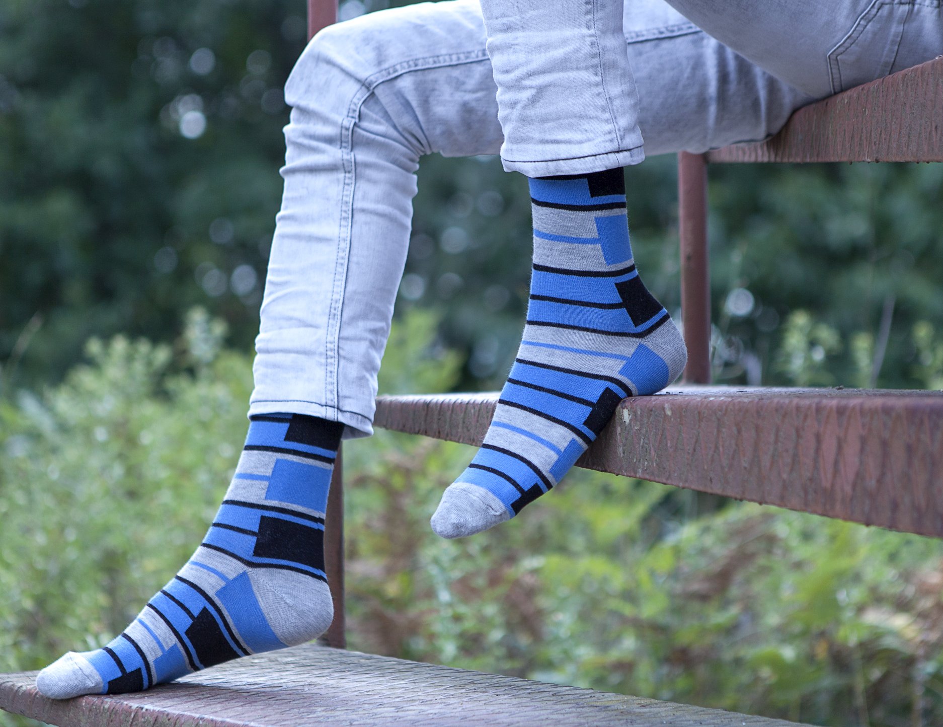 Men's blue patterned socks featuring vibrant designs and soft cotton material, perfect for stylish comfort.