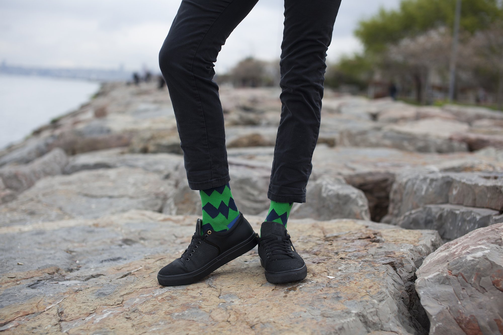 Person wearing green patterned socks