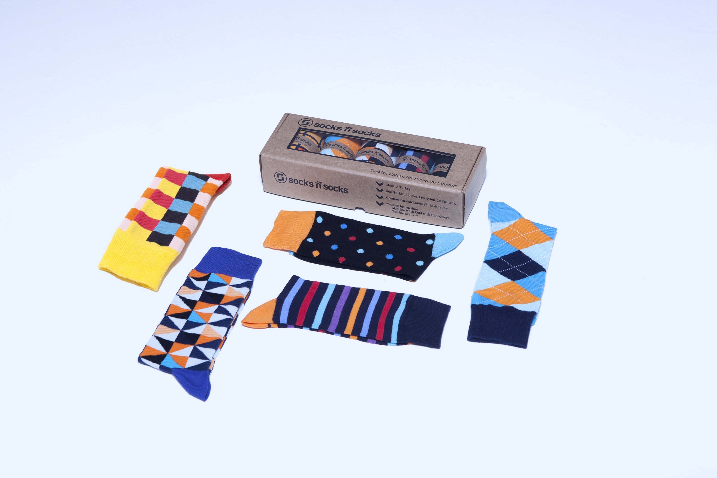 A collection of colorful men's dress socks featuring trendy patterns and designs, perfect for adding style to any outfit.