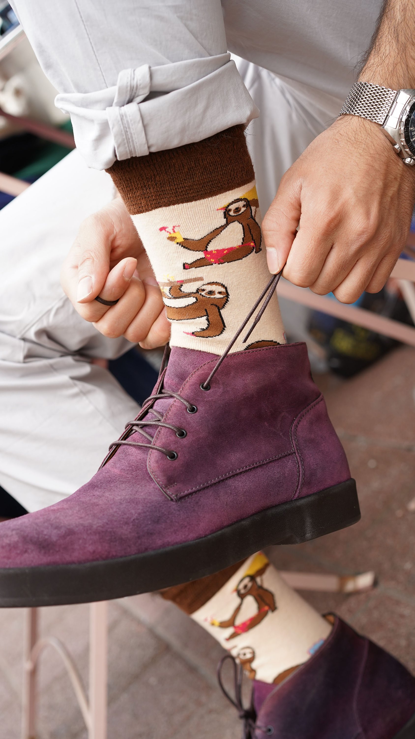 A collection of colorful men's funky socks featuring various trendy patterns and designs, perfect for adding style to any outfit.