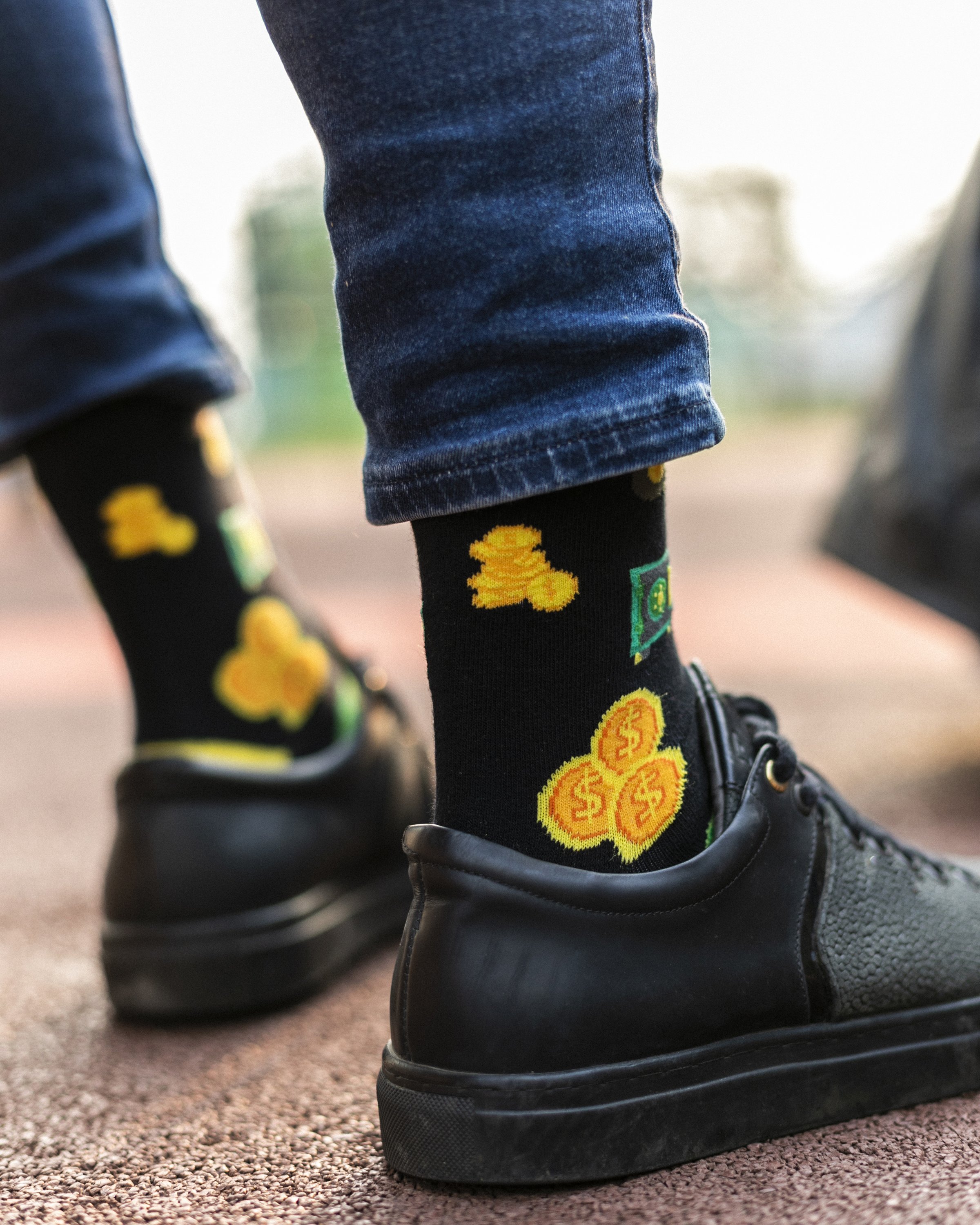 Men's Money Socks featuring colorful designs and premium cotton material, perfect for adding style to any outfit.