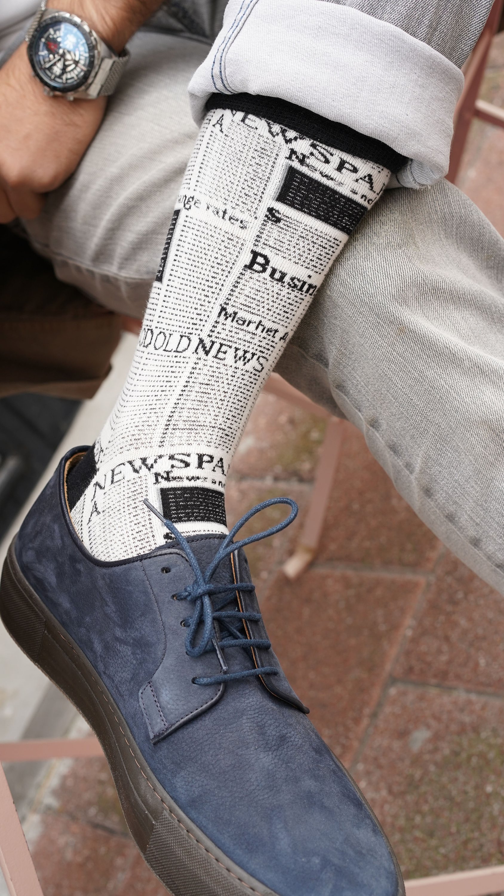 Men's Newspaper Socks featuring colorful designs and patterns, made from soft Turkish cotton for comfort and style.