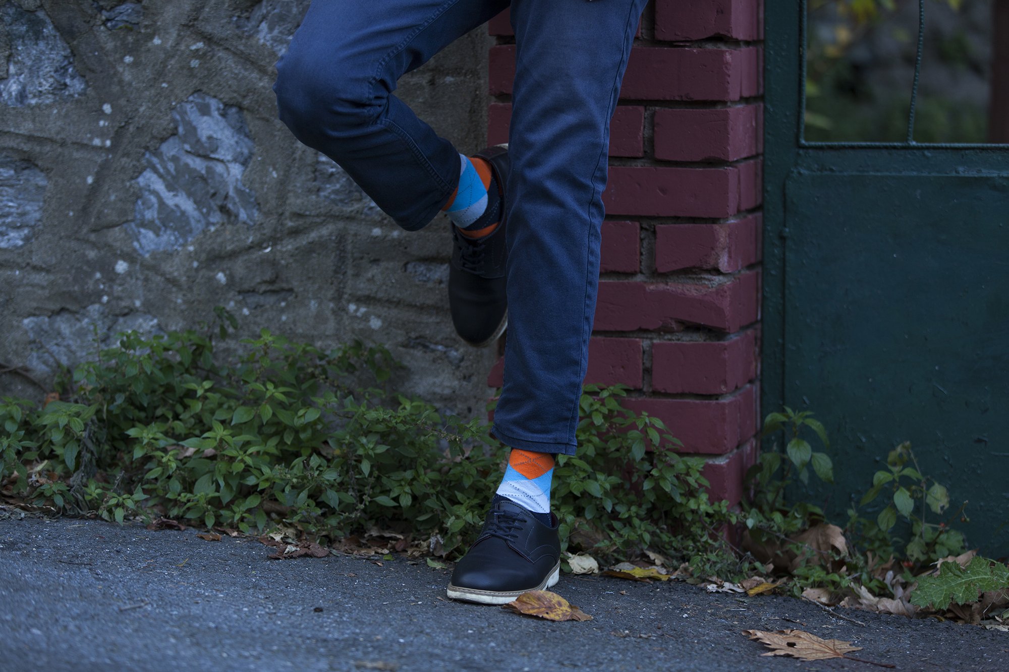 Men's Orange Peel Argyle Socks featuring vibrant colors and a trendy pattern, perfect for adding style to any outfit.