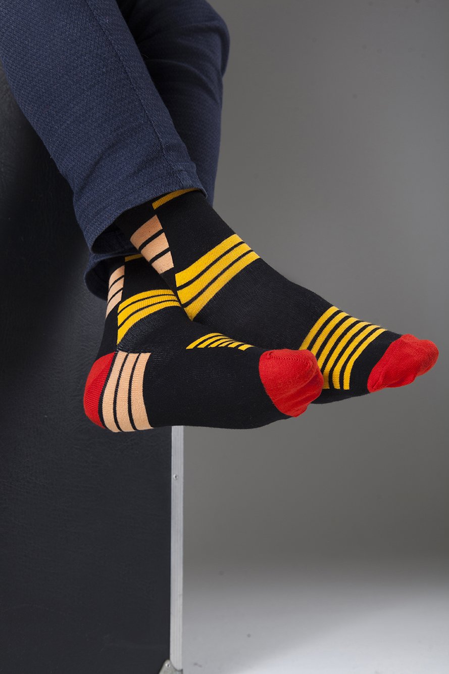 Men's orange stripe socks made from soft Turkish cotton, featuring a trendy design for comfort and style.