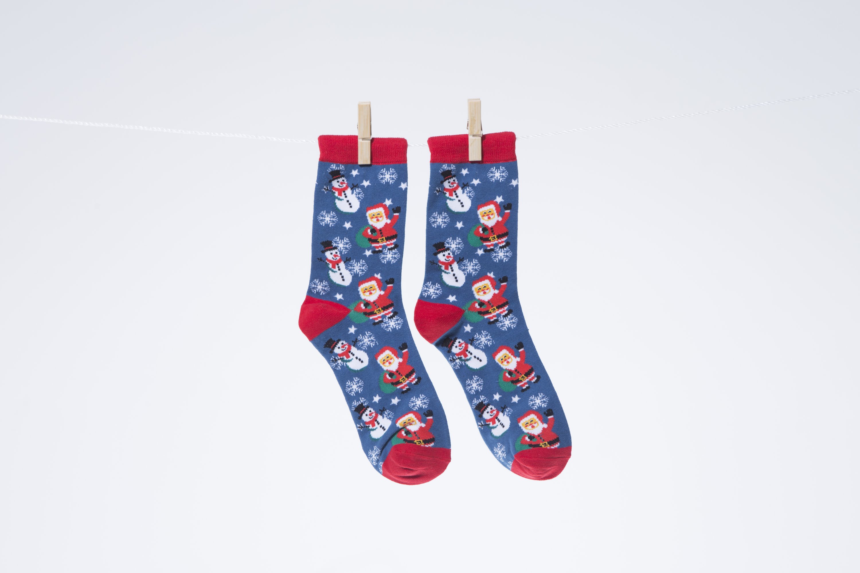 Men's Santa Socks featuring a festive design, made from soft combed cotton for comfort.