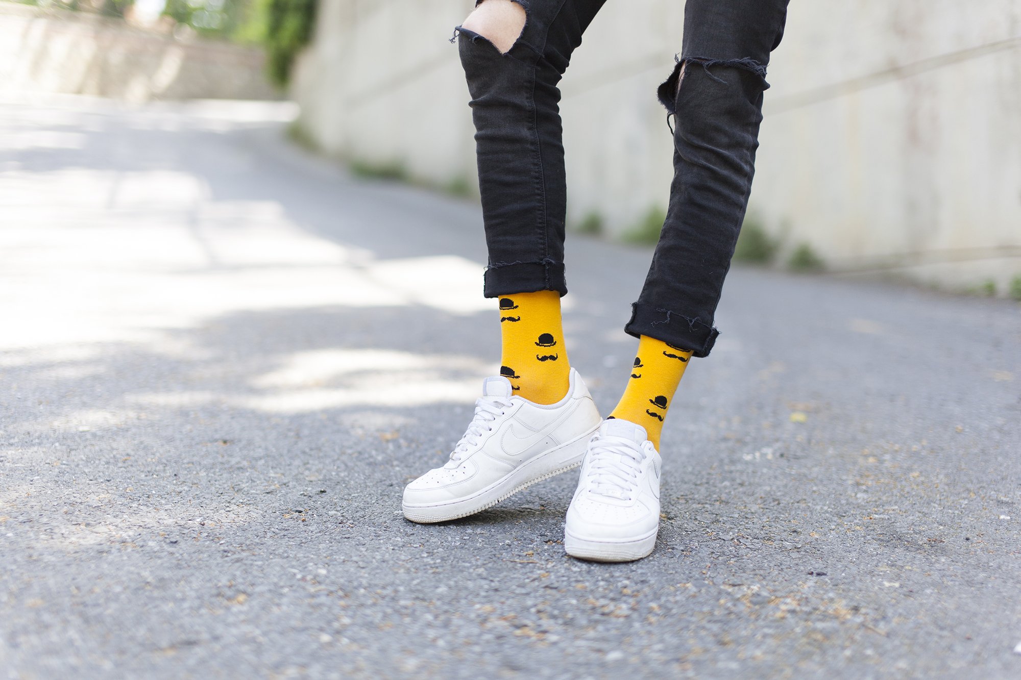 Men's Stache Socks featuring colorful designs and premium cotton material, perfect for adding a fun touch to any outfit.