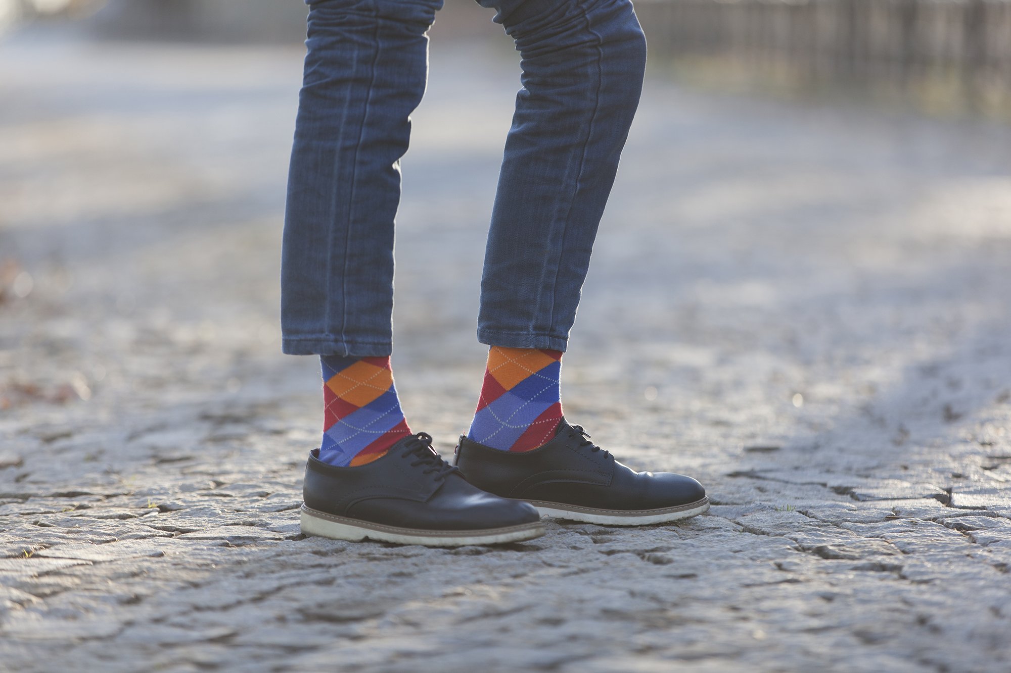 Men's Tangerine Argyle Socks featuring a vibrant orange and blue pattern, perfect for adding a stylish touch to any outfit.