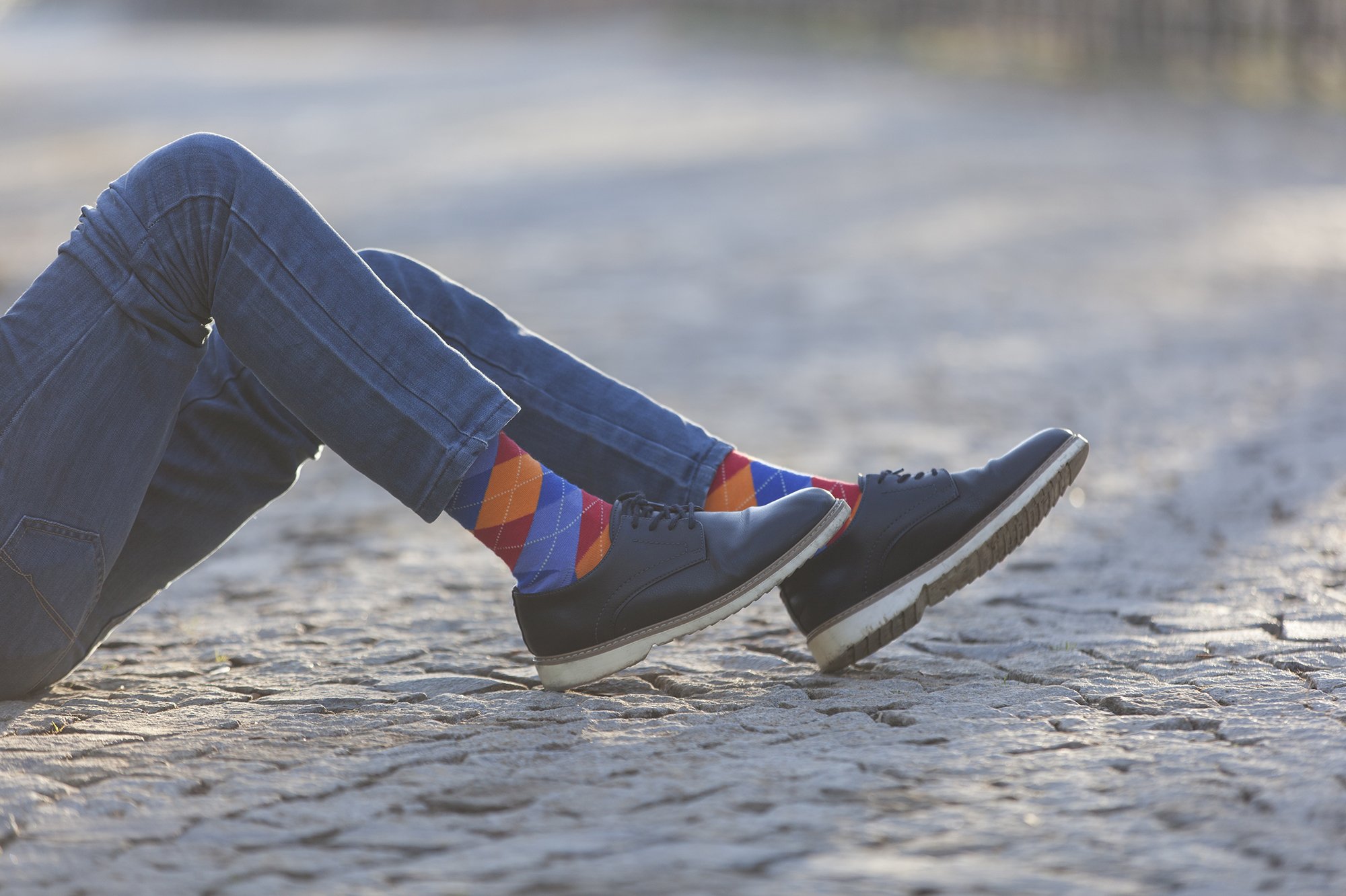 Men's Tangerine Argyle Socks featuring a vibrant orange and blue pattern, perfect for adding a stylish touch to any outfit.