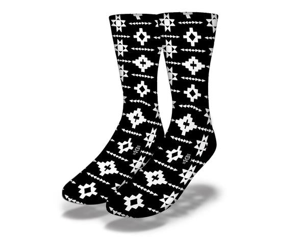 A pair of Native Pattern (style 5) socks featuring intricate designs and vibrant colors, showcasing their unique style and comfortable fabric.