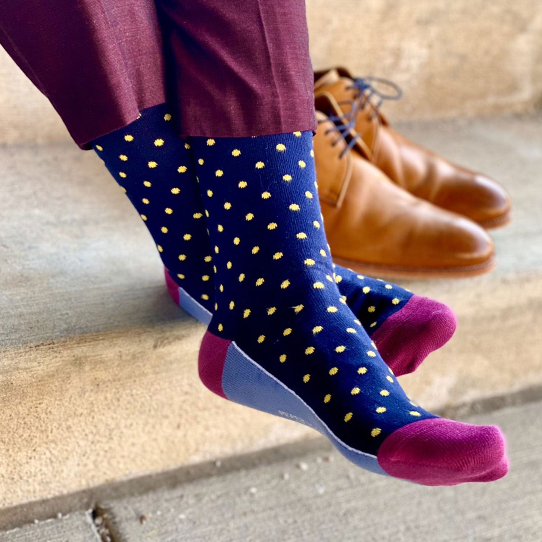 Pin Polka Men's Socks in Midnight featuring vibrant polka dots and contrasting cuff, heel, and toe, made from luxurious Supima cotton.