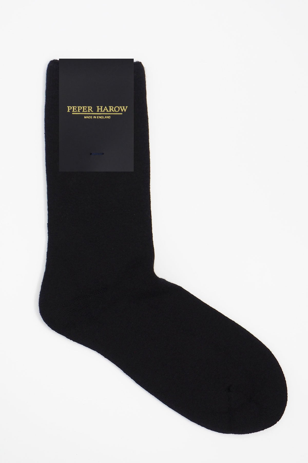 A pair of luxurious black men's bed socks made from soft Supima cotton, showcasing their fluffy interior and seamless toe design.