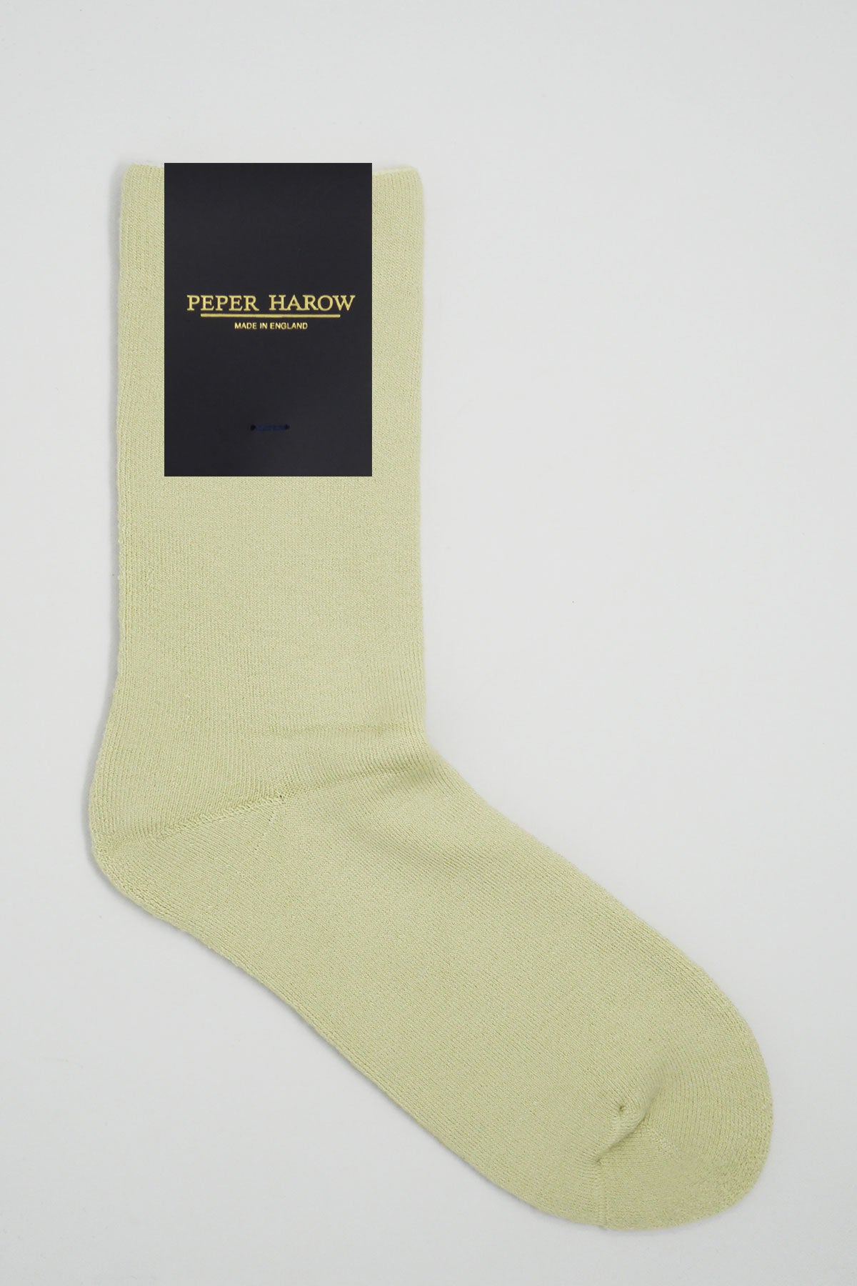 Cream colored Plain Men's Bed Socks made from luxurious Supima cotton, showcasing a fluffy interior and seamless toe design.