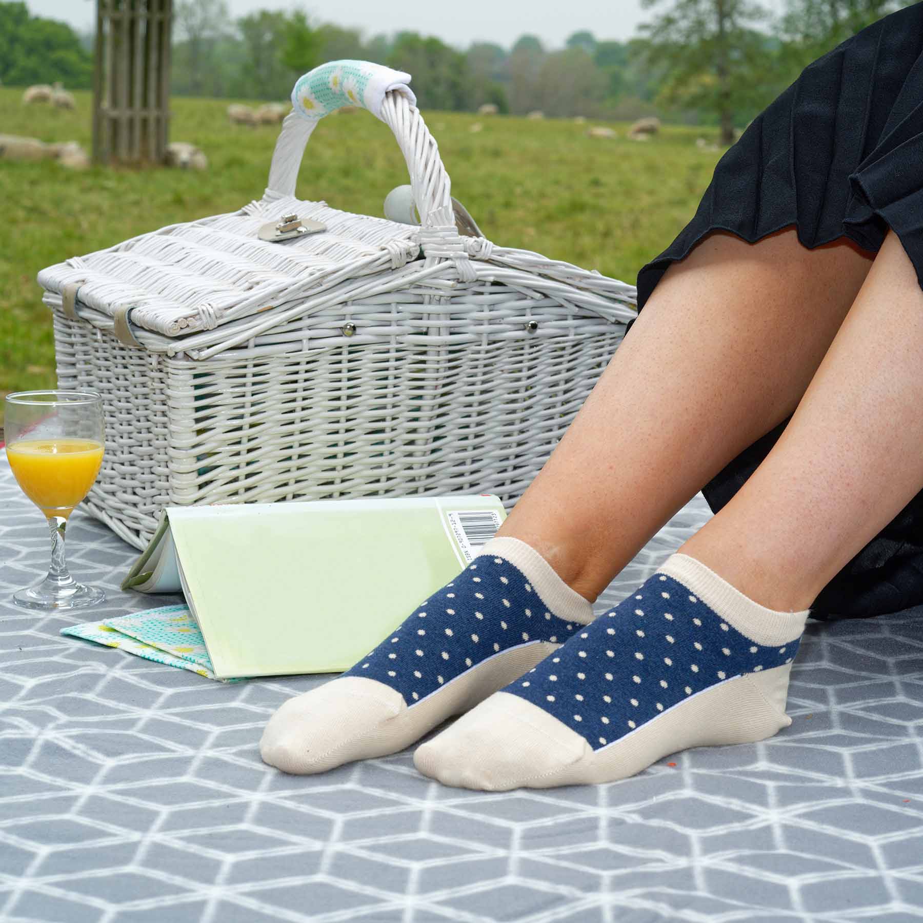 Polka Women's Organic Trainer Socks in beige with denim blue polka dots, showcasing a stylish and eco-friendly design.