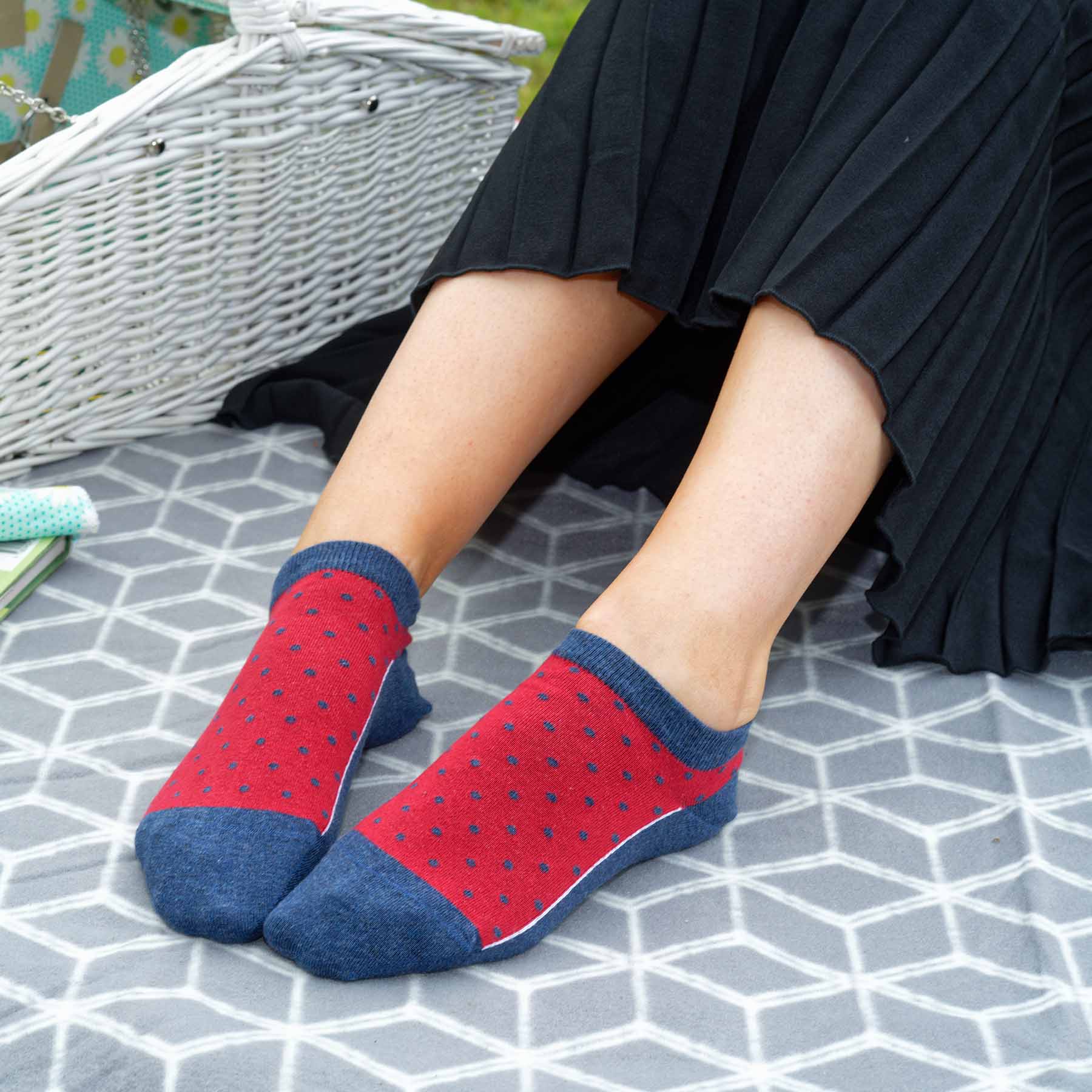 Polka Women's Organic Trainer Socks in Denim with cherry red and denim polka dot design, showcasing their soft texture and seamless toe.