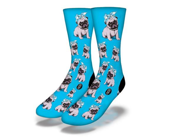 PUG PUPPY LOVE IN BLUE Fun Dog Socks featuring cute pug puppies with ribbons on a vibrant blue background.