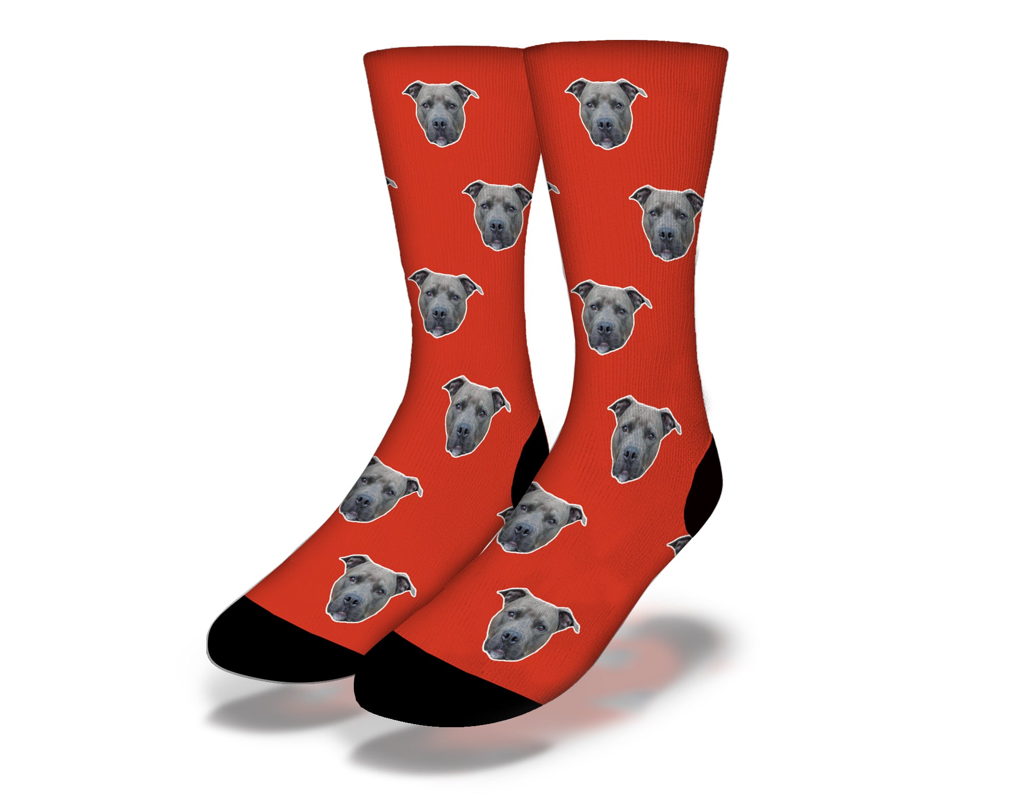 A pair of red socks featuring cute puppy dog eyes design, perfect for pet lovers.