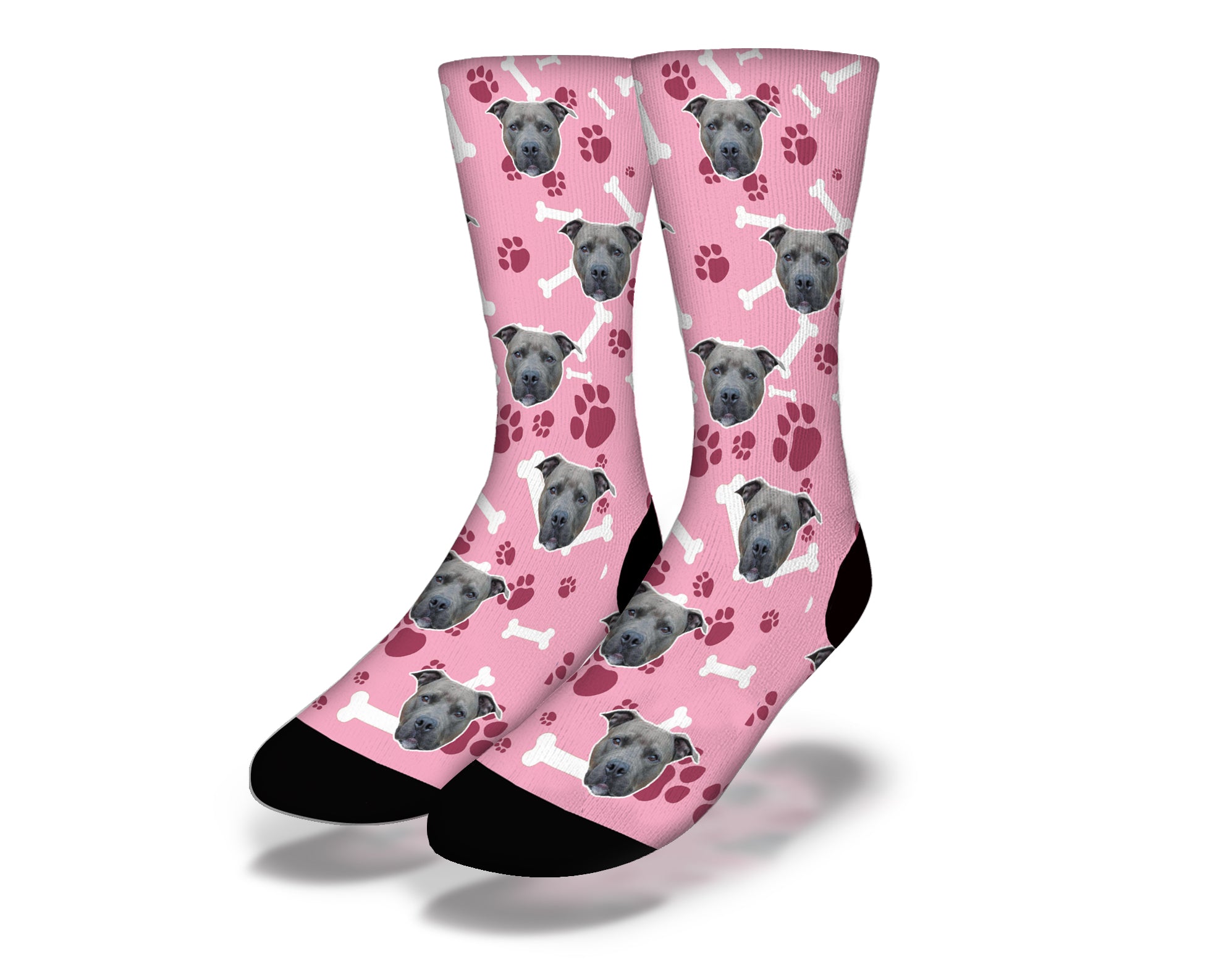 Cute pink socks featuring puppy dog eyes and paw prints, perfect for dog lovers.