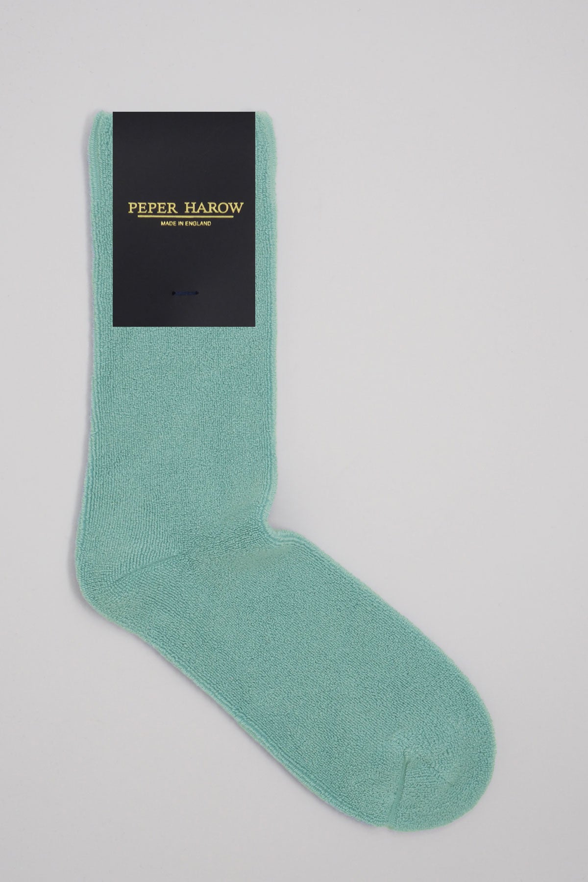 A pair of blue Ribbed Cuff Men's Bed Socks made from luxurious Supima cotton, featuring a stylish ribbed cuff and seamless toe design.