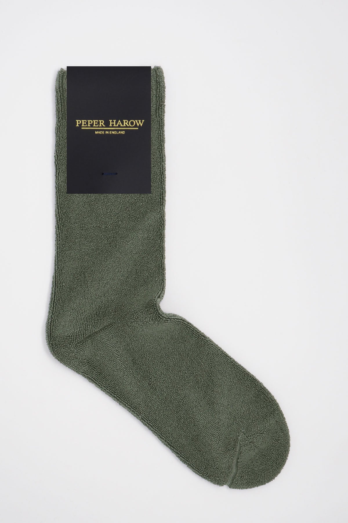 A pair of grey Ribbed Cuff Men's Bed Socks made from luxurious Supima cotton, featuring a soft and fluffy texture with a stylish ribbed cuff.