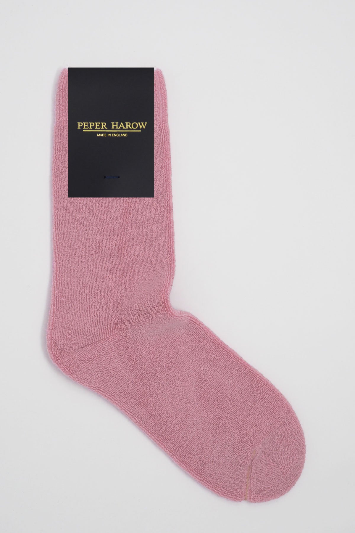 A pair of luxurious pink Ribbed Cuff men's bed socks made from Supima cotton, featuring a soft texture and seamless toe design.