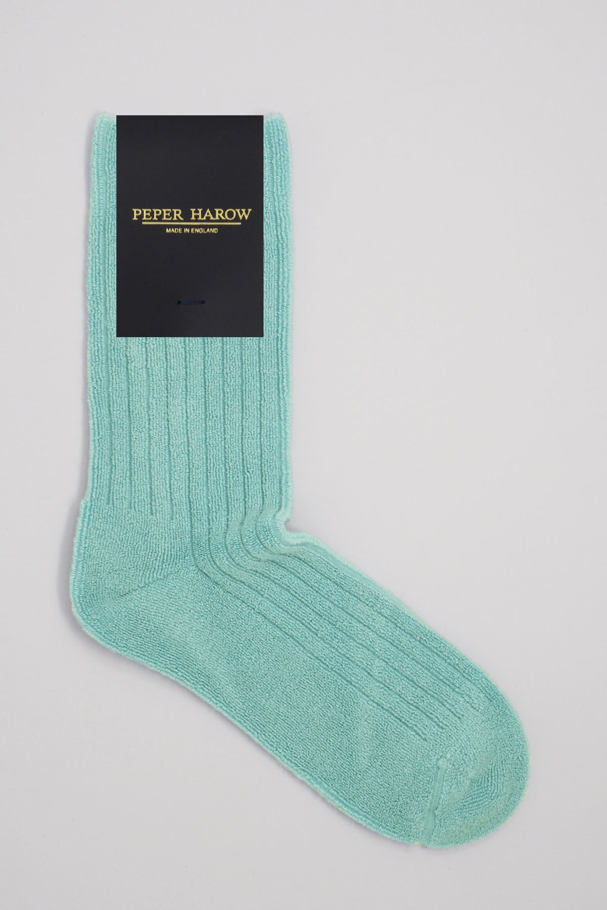 A pair of blue ribbed men's bed socks made from soft Supima cotton, showcasing a fluffy texture and seamless toe design.