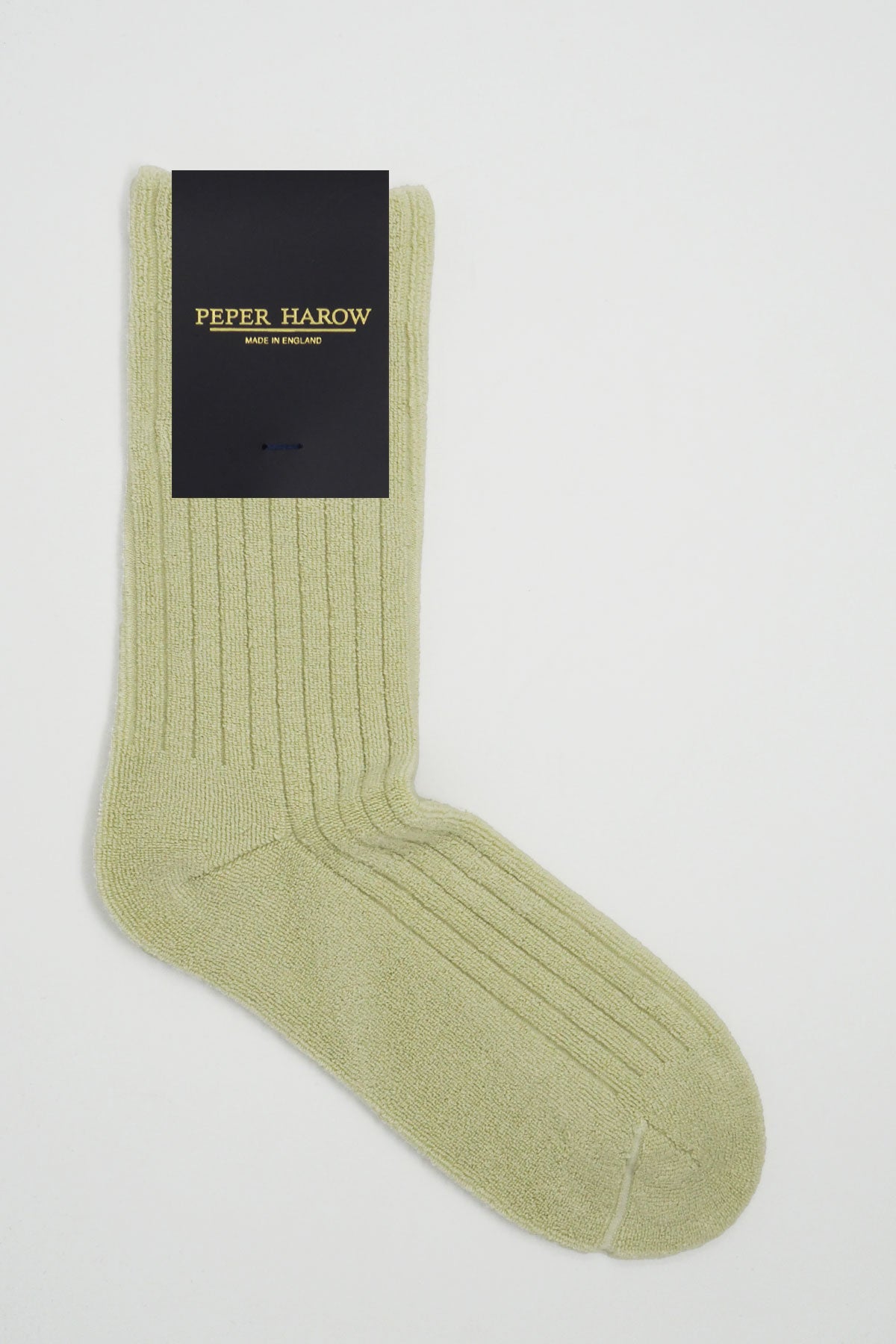 Cream ribbed men's bed socks made from luxurious Supima cotton, featuring a fluffy ribbed pattern for ultimate comfort.