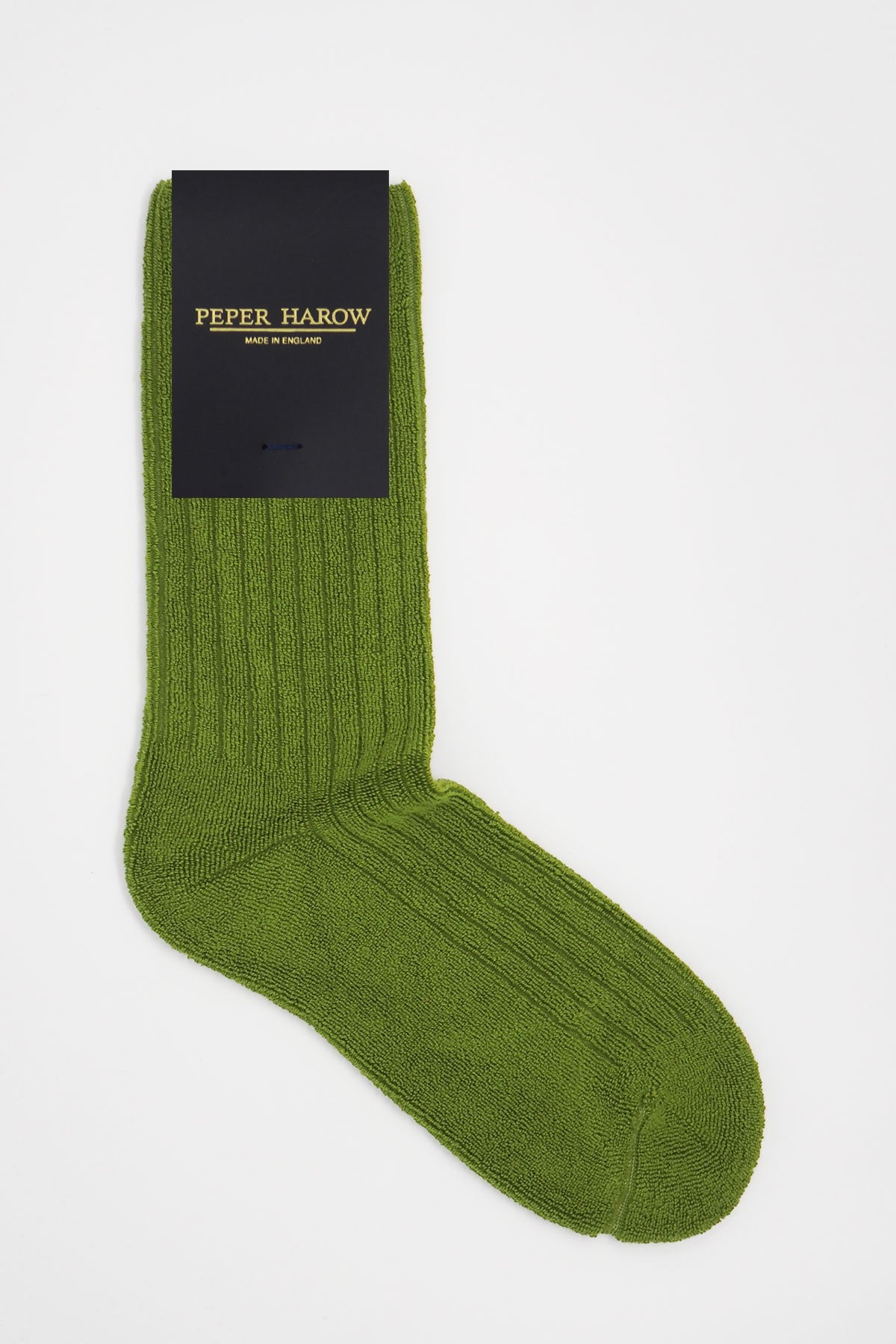 A pair of green ribbed men's bed socks made from luxurious Supima cotton, featuring a fluffy texture and seamless toe design.