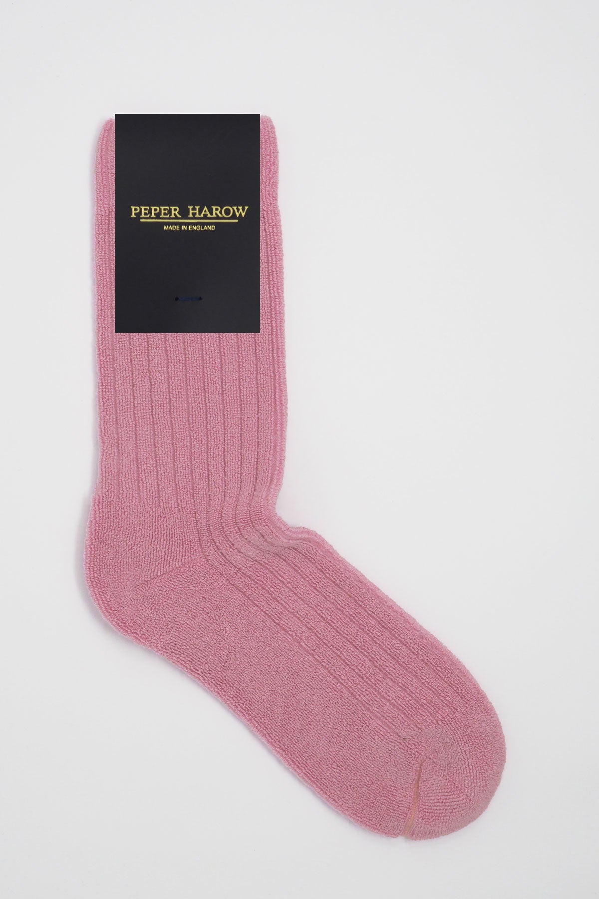 A pair of pink ribbed men's bed socks, showcasing a fluffy texture and seamless toe design, perfect for cozy winter days.