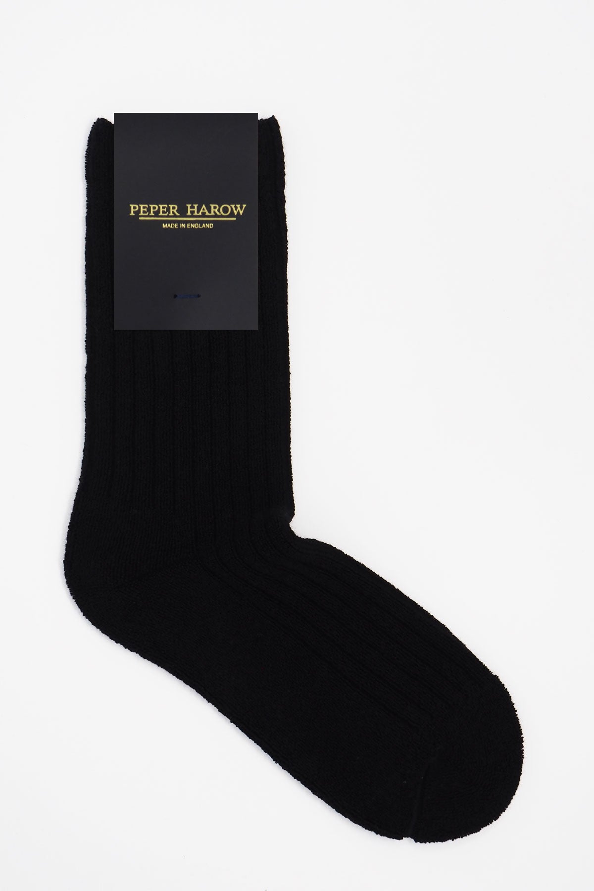 A pair of black ribbed women's bed socks made from soft Supima cotton, featuring a fluffy texture and seamless toe design.