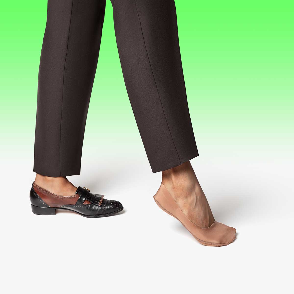 A pair of tan mid-cut ultra-thin no show socks designed for discreet wear with dress shoes.