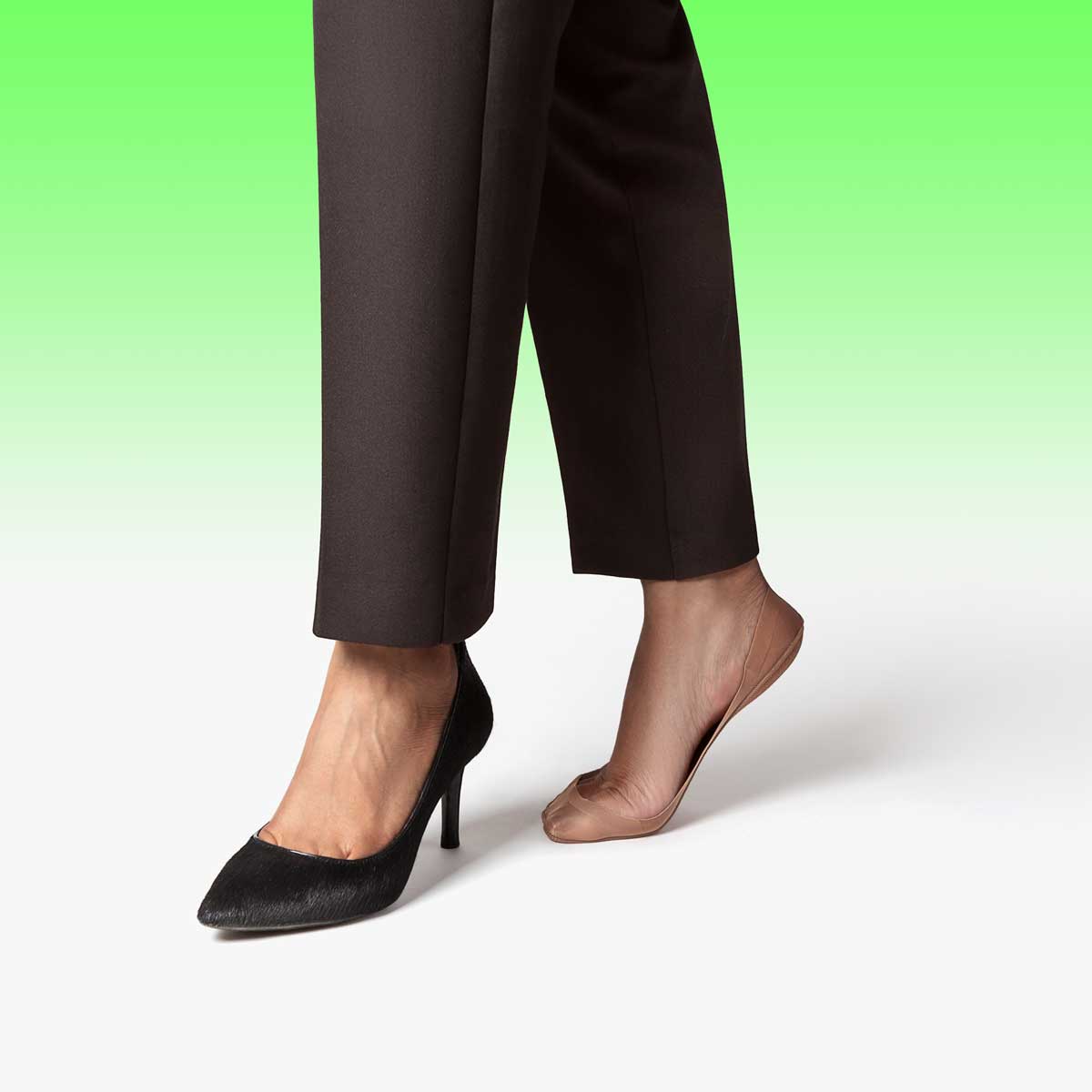 A pair of tan ultra low-cut no show socks designed for comfort and invisibility, perfect for wearing with heels and ballet flats.