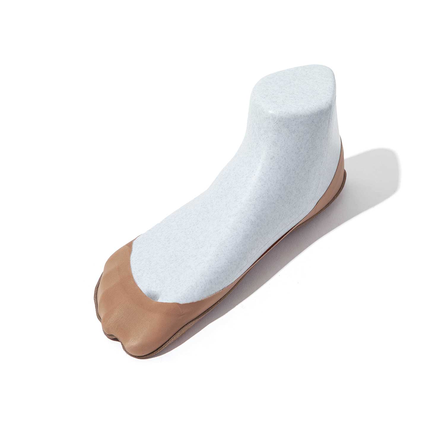 A pair of tan ultra low-cut no show socks designed for comfort and invisibility, perfect for wearing with heels and ballet flats.