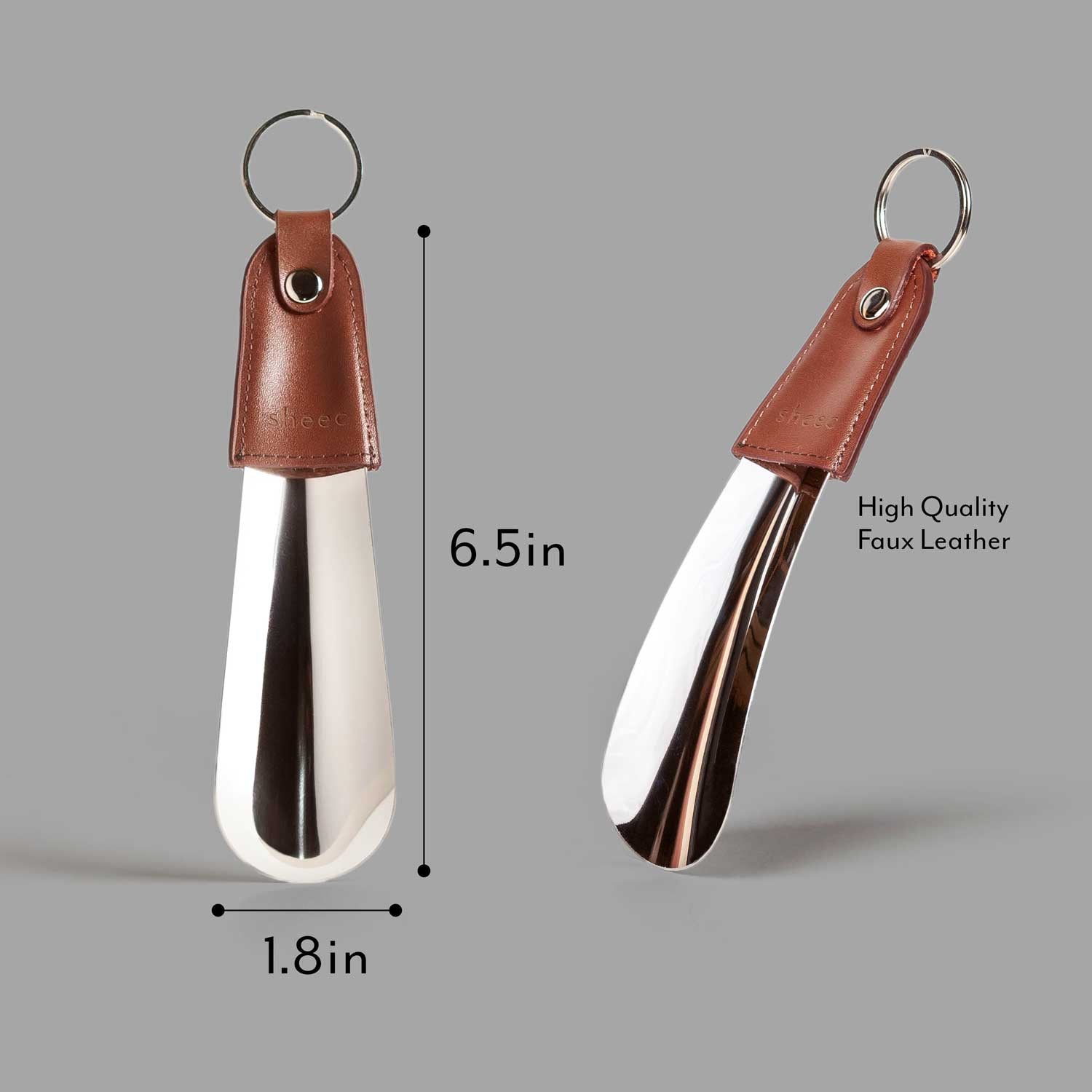 Small metal shoe horn with a faux leather handle, showcasing its sleek design and premium materials.