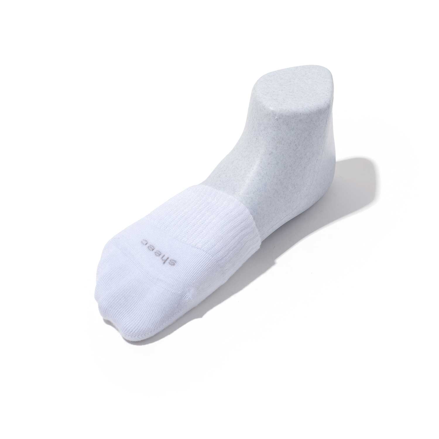 A pair of white super soft modal toe cover half socks designed for women, ideal for backless sneakers and casual wear.