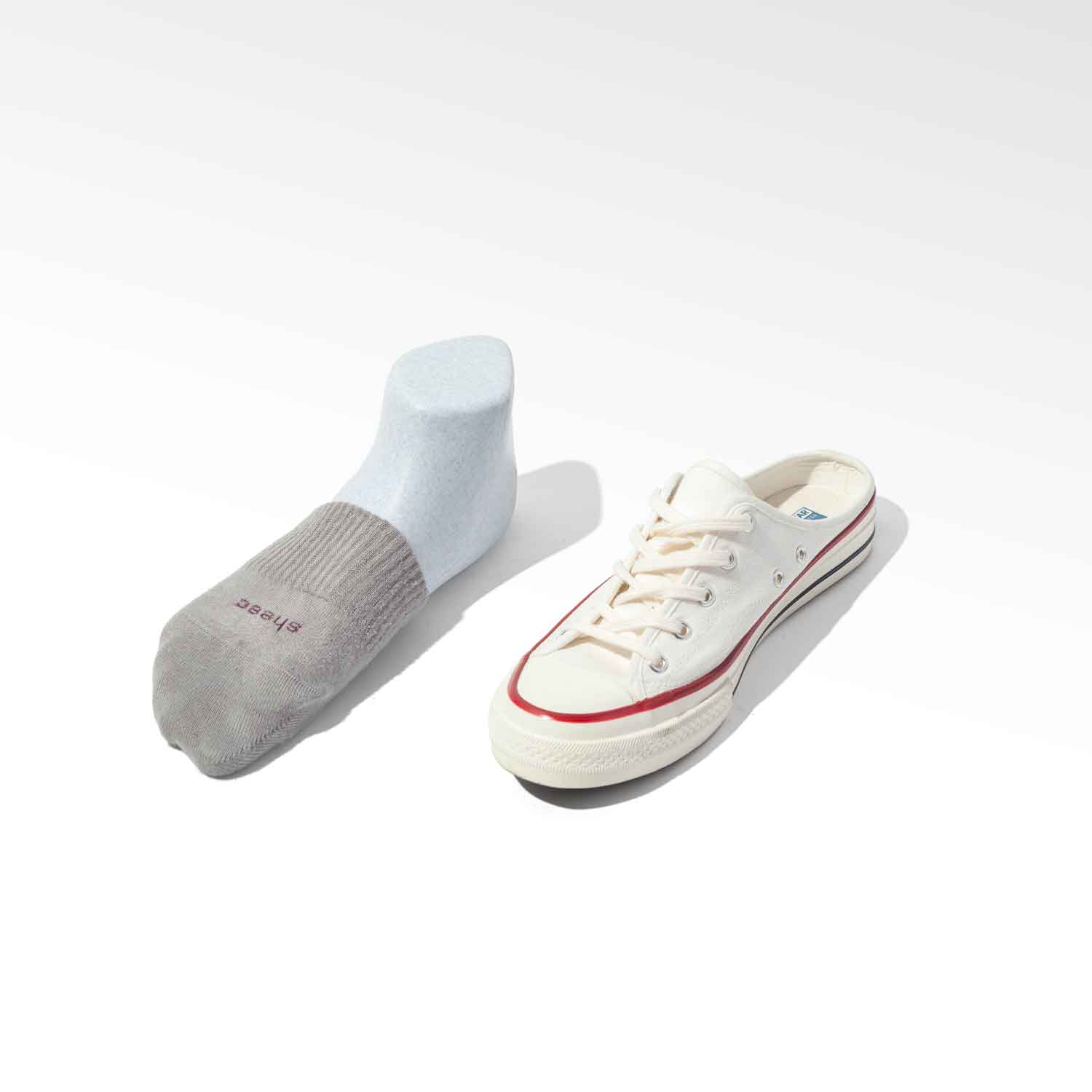 A pair of white super soft modal toe cover half socks designed for women, ideal for backless sneakers and casual wear.