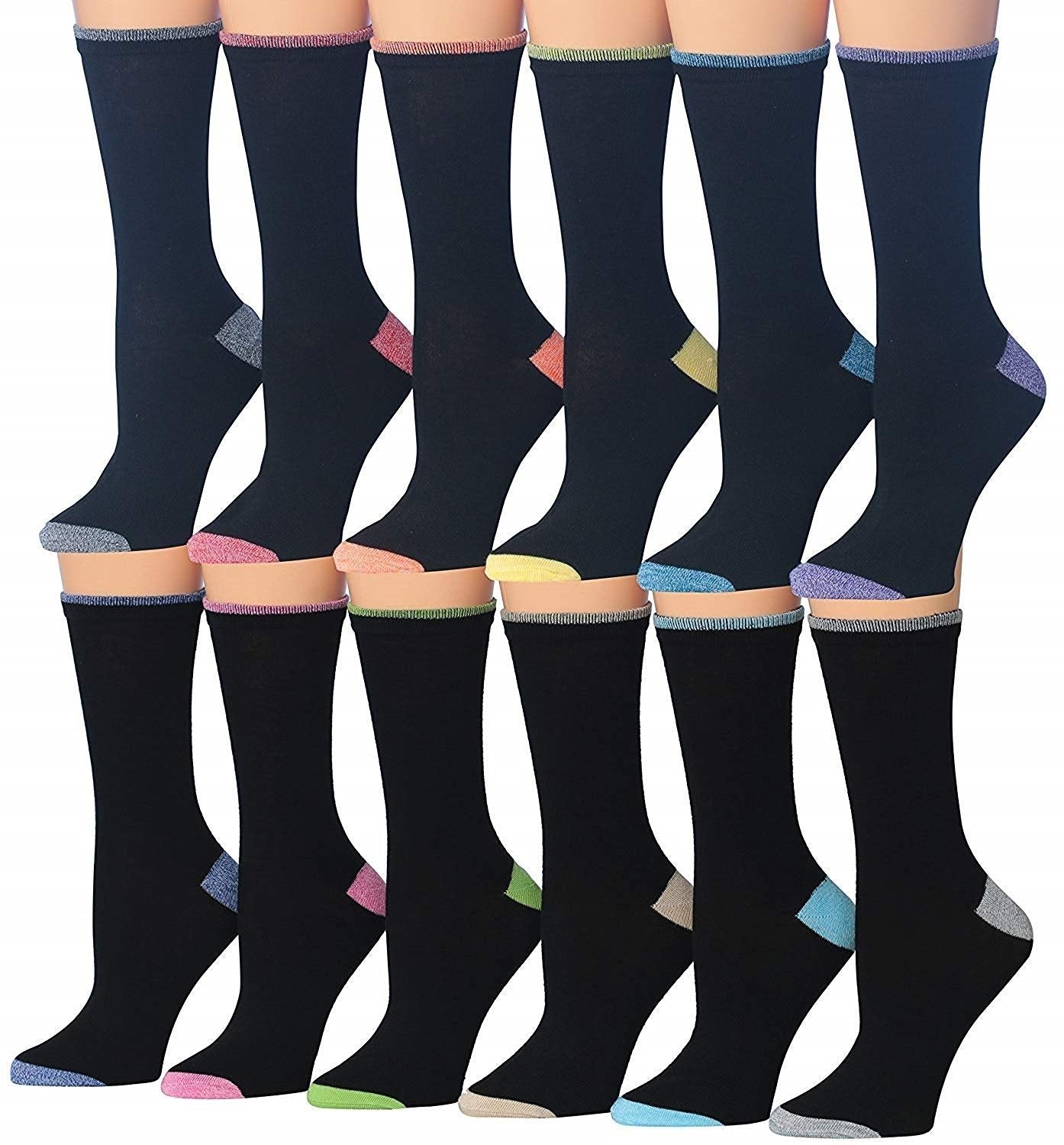 A colorful assortment of Tipi Toe Women's crew socks featuring various patterns and designs, neatly arranged in pairs.