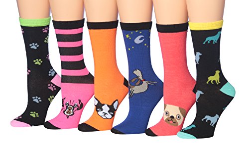 A colorful assortment of Tipi Toe Women's penguin novelty socks, featuring various playful penguin designs in a cozy winter setting.