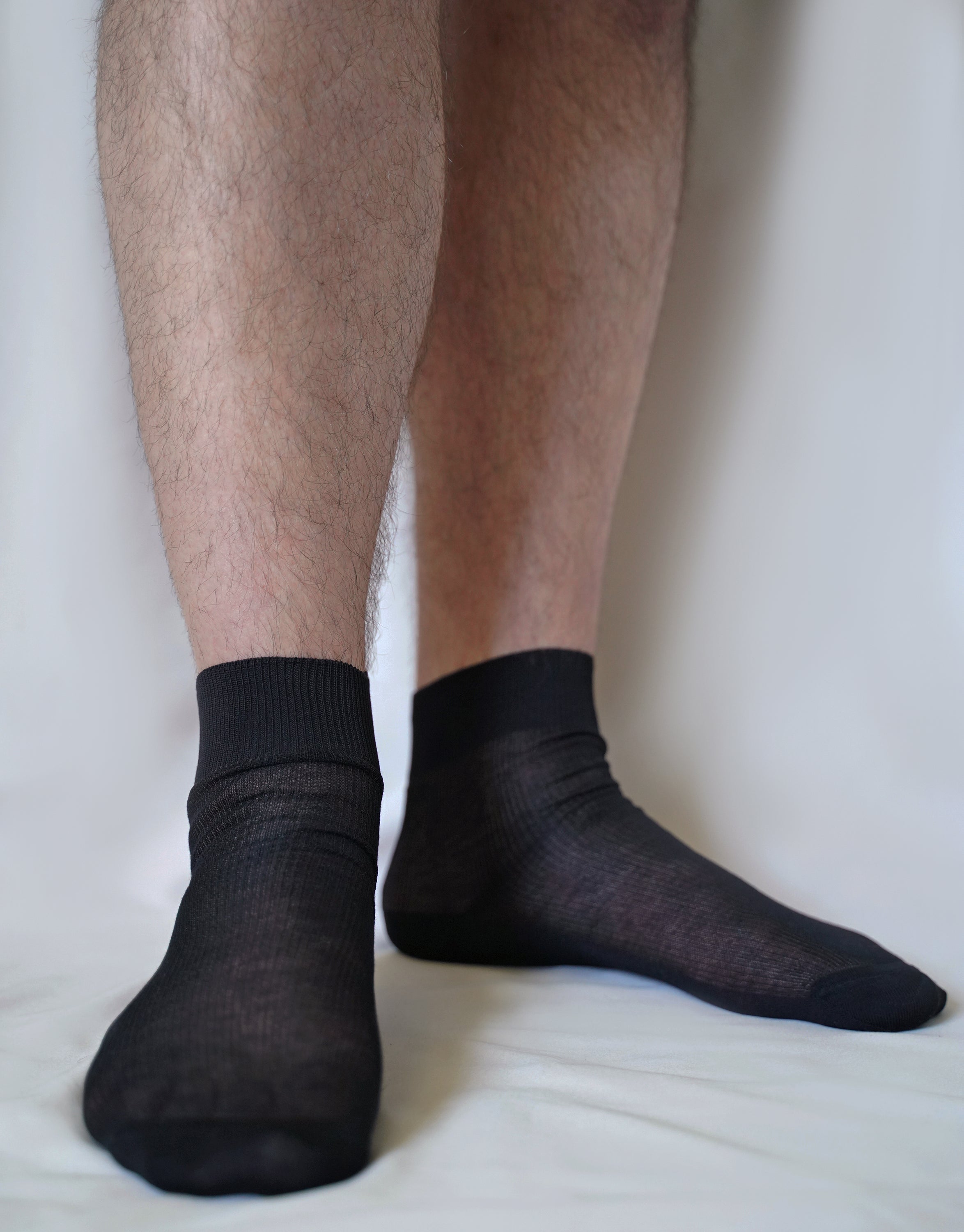 A pair of luxurious tittimitti® 100% Mercerized 'Filo di Scozia' Cotton Men's Dress Socks, showcasing their silky smooth texture and elegant design.